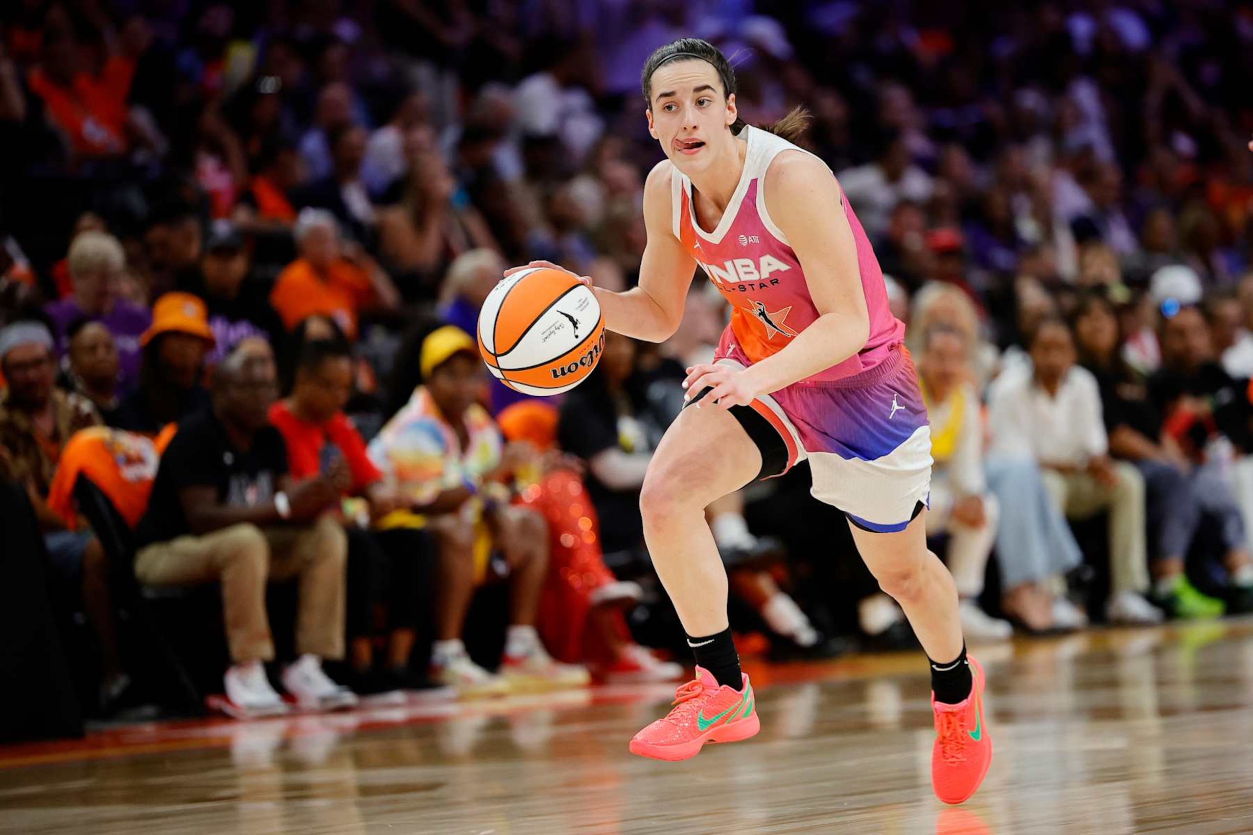 PHOENIX, ARIZONA - JULY 20: Caitlin Clark #22 of Team WNBA drives against the USA Basketball Women's National Team during the first half of the 2024 WNBA All-Star game at Footprint Center on July 20, 2024 in Phoenix, Arizona. NOTE TO USER: User expressly acknowledges and agrees that, by downloading and or using this photograph, User is consenting to the terms and conditions of the Getty Images License Agreement. (Photo by Alex Slitz/Getty Images) PHOENIX, ARIZONA - JULY 20: Caitlin Clark #22 of Team WNBA drives against the USA Basketball Women's National Team during the first half of the 2024 WNBA All-Star game at Footprint Center on July 20, 2024 in Phoenix, Arizona. NOTE TO USER: User expressly acknowledges and agrees that, by downloading and or using this photograph, User is consenting to the terms and conditions of the Getty Images License Agreement. (Photo by Alex Slitz/Getty Images)