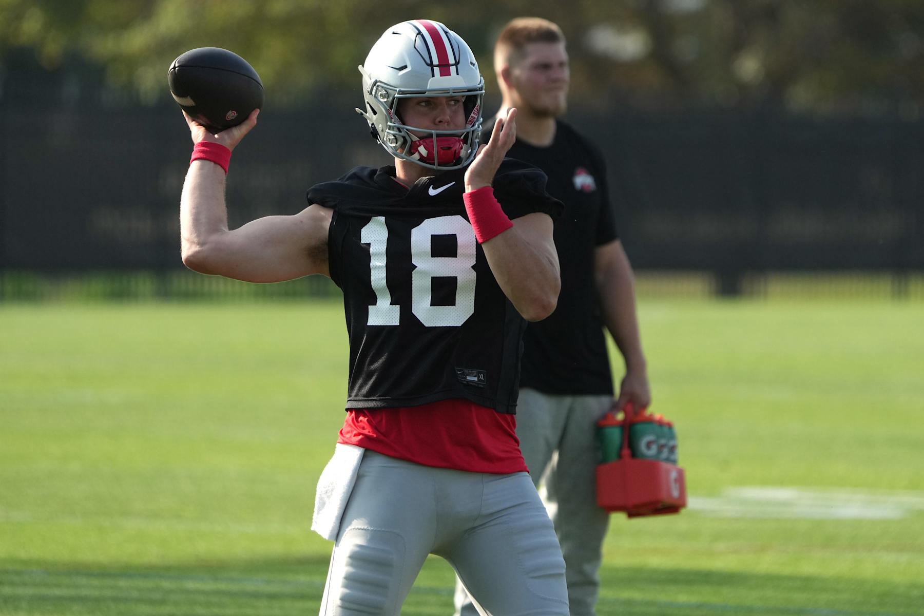 COLUMBUS, OHIO - AUGUST 01: Will Howard #18 of the Ohio State Buckeyes  at the throws the ball during fall camp at the Woody Hayes Athletic Center on August 01, 2024 in Columbus, Ohio. (Photo by Jason Mowry/Getty Images)