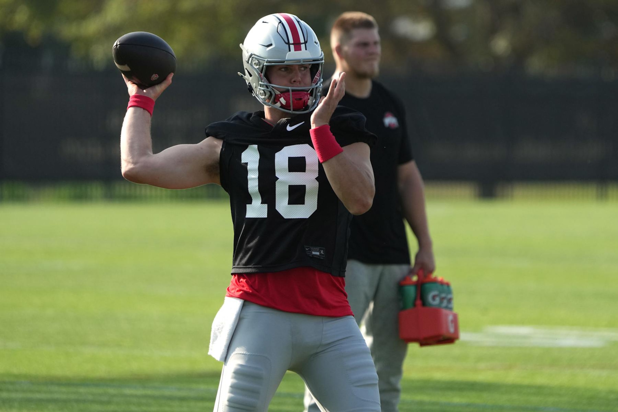 COLUMBUS, OHIO - AUGUST 01: Will Howard #18 of the Ohio State Buckeyes at the throws the ball during fall camp at the Woody Hayes Athletic Center on August 01, 2024 in Columbus, Ohio. (Photo by Jason Mowry/Getty Images) COLUMBUS, OHIO - AUGUST 01: Will Howard #18 of the Ohio State Buckeyes at the throws the ball during fall camp at the Woody Hayes Athletic Center on August 01, 2024 in Columbus, Ohio. (Photo by Jason Mowry/Getty Images)