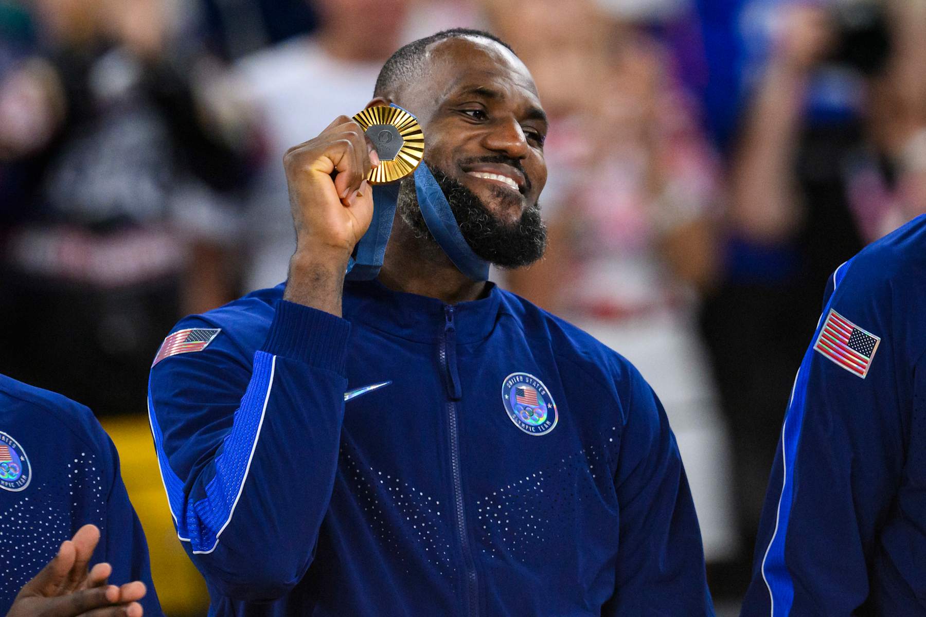 PARIS, FRANCE - AUGUST 11: Gold medalist LeBron James of Team United States celebrate on the podium during the Men's basketball medal ceremony on day fifteen of the Olympic Games Paris 2024 at the Bercy Arena on August 11, 2024 in Paris, France. (Photo by Tom Weller/VOIGT/GettyImages)