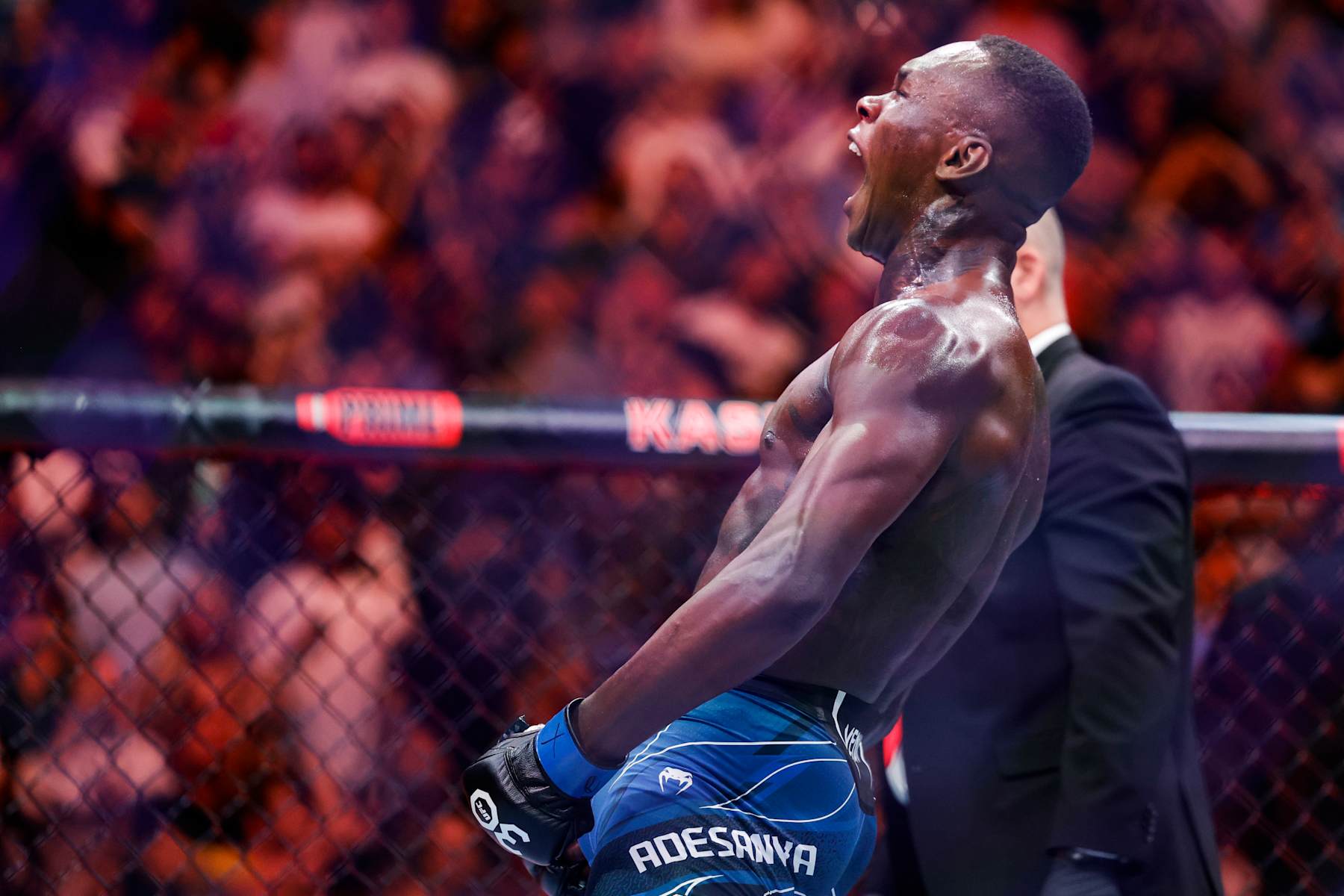 Israel Adesanya celebrates after knocking out Alex Pereira