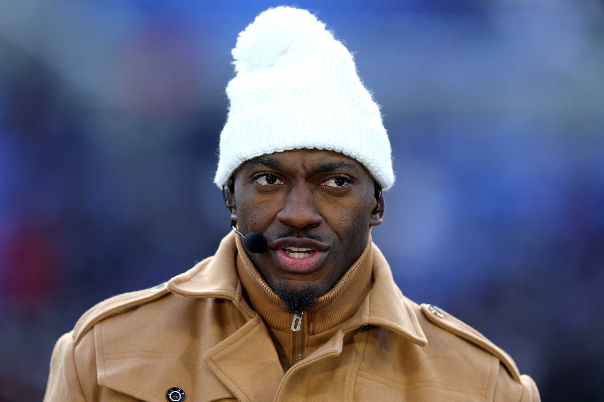 BALTIMORE, MARYLAND - JANUARY 20: Former NFL quarterback and current ESPN analyst Robert Griffin III looks on before the start of the Baltimore Ravens and Houston Texans AFC Divisional Playoff game at M&T Bank Stadium on January 20, 2024 in Baltimore, Maryland. (Photo by Rob Carr/Getty Images) BALTIMORE, MARYLAND - JANUARY 20: Former NFL quarterback and current ESPN analyst Robert Griffin III looks on before the start of the Baltimore Ravens and Houston Texans AFC Divisional Playoff game at M&T Bank Stadium on January 20, 2024 in Baltimore, Maryland. (Photo by Rob Carr/Getty Images)