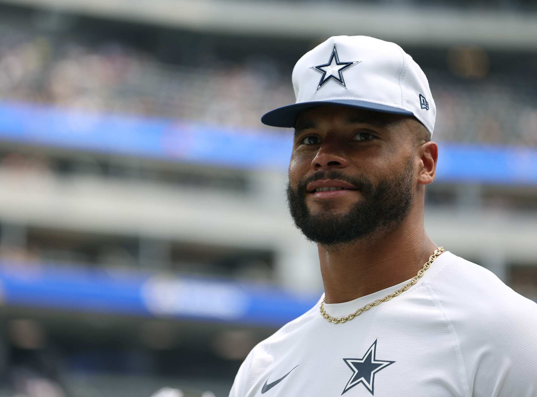 INGLEWOOD, CALIFORNIA - AUGUST 11: Dak Prescott #4 of the Dallas Cowboys smiles before a preseason game against the Los Angeles Rams at SoFi Stadium on August 11, 2024 in Inglewood, California. (Photo by Harry How/Getty Images)
