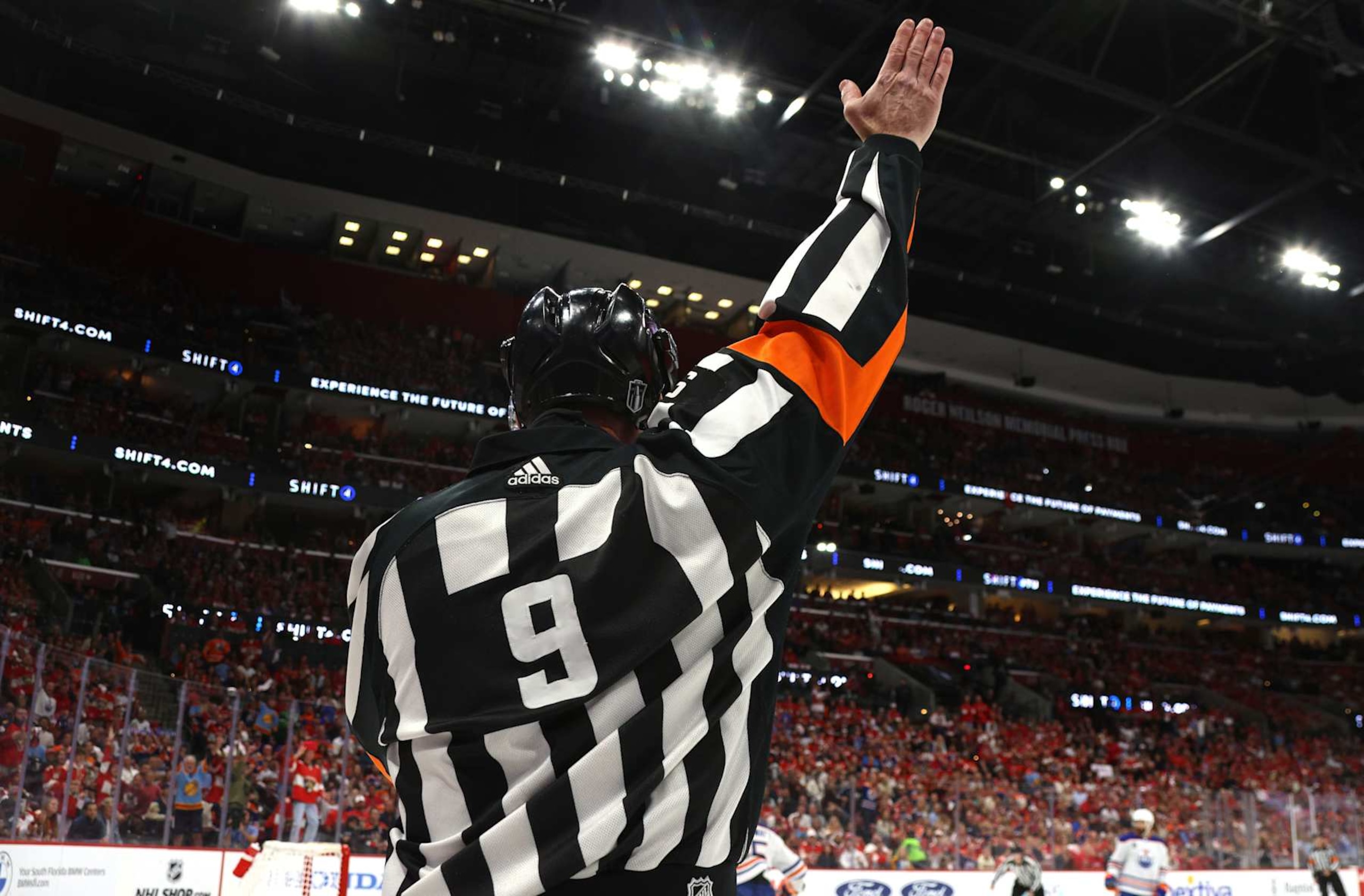 SUNRISE, FLORIDA - JUNE 24: Referee Dan O'Rourke #9 raises his arm to make a call during the first period of Game Seven of the 2024 Stanley Cup Final between the Edmonton Oilers and the Florida Panthers at Amerant Bank Arena on June 24, 2024 in Sunrise, Florida. (Photo by Dave Sandford/NHLI via Getty Images)