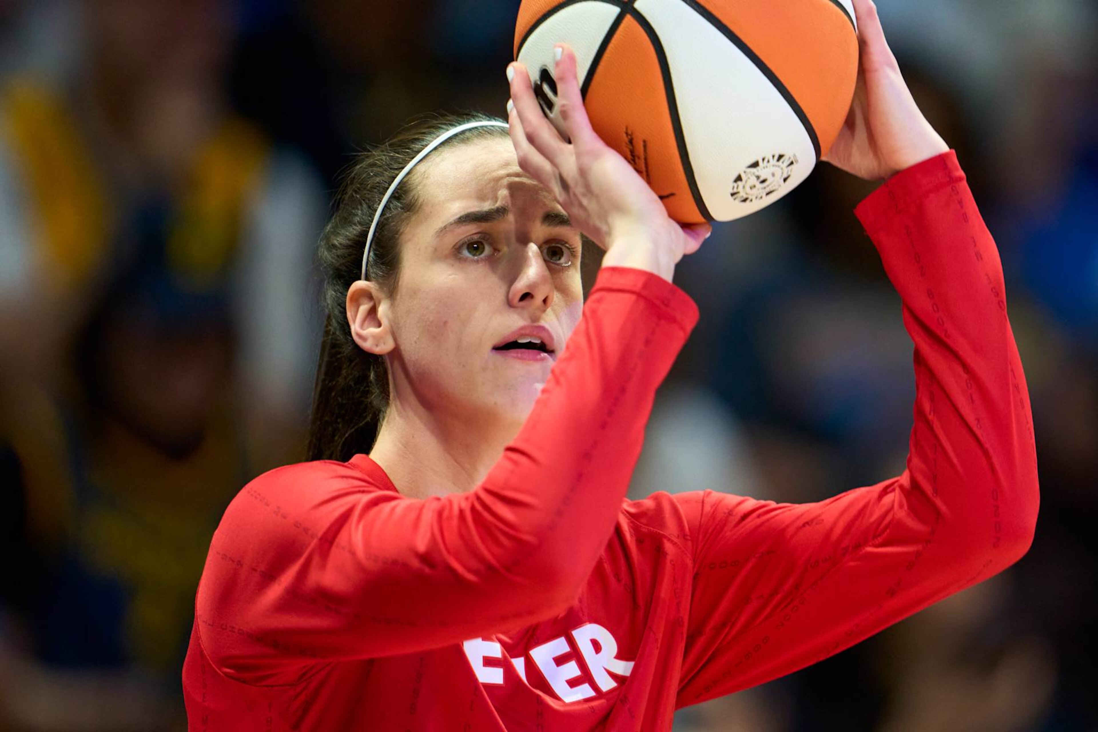 ARLINGTON, TEXAS - JULY 17: Caitlin Clark #22 of the Indiana Fever warms up before tipoff against the Dallas Wings at the College Park Center on July 17, 2024 in Arlington, Texas. NOTE TO USER: User expressly acknowledges and agrees that, by downloading and or using this photograph, User is consenting to the terms and conditions of the Getty Images License Agreement.  (Photo by Cooper Neill/Getty Images)