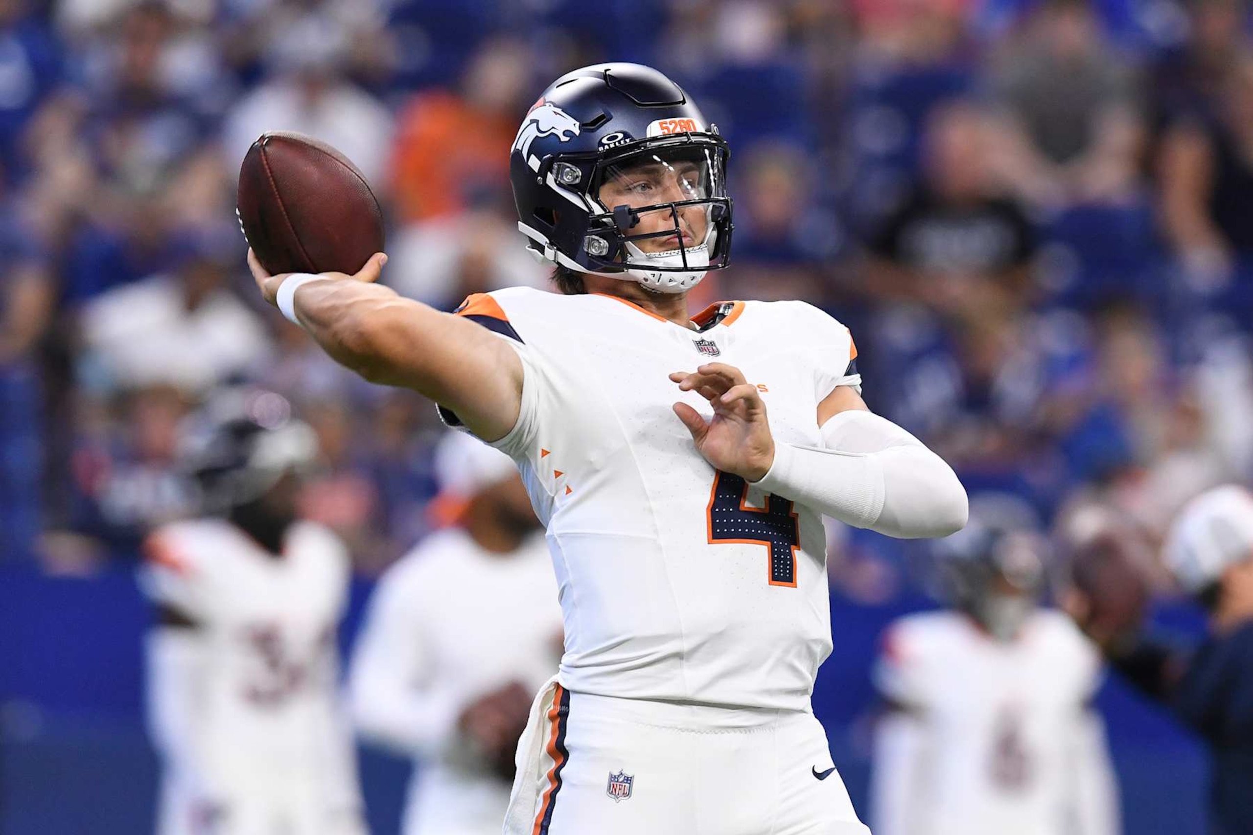 INDIANAPOLIS, IN - AUGUST 11: Denver Broncos Quarterback Zach Wilson (4) warms up for the NFL Preseason game between the Denver Broncos and the Indianapolis Colts on August 11, 2024, at Lucas Oil Stadium in Indianapolis, Indiana. (Photo by Michael Allio/Icon Sportswire via Getty Images)