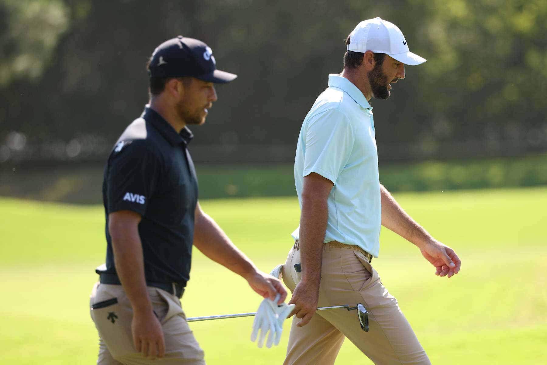 MEMPHIS, TENNESSEE - AUGUST 16: Xander Schauffele of the United States and  Scottie Scheffler of the United States walks the first fairway during the second round of the FedEx St. Jude Championship at TPC Southwind on August 16, 2024 in Memphis, Tennessee. (Photo by Mike Mulholland/Getty Images)