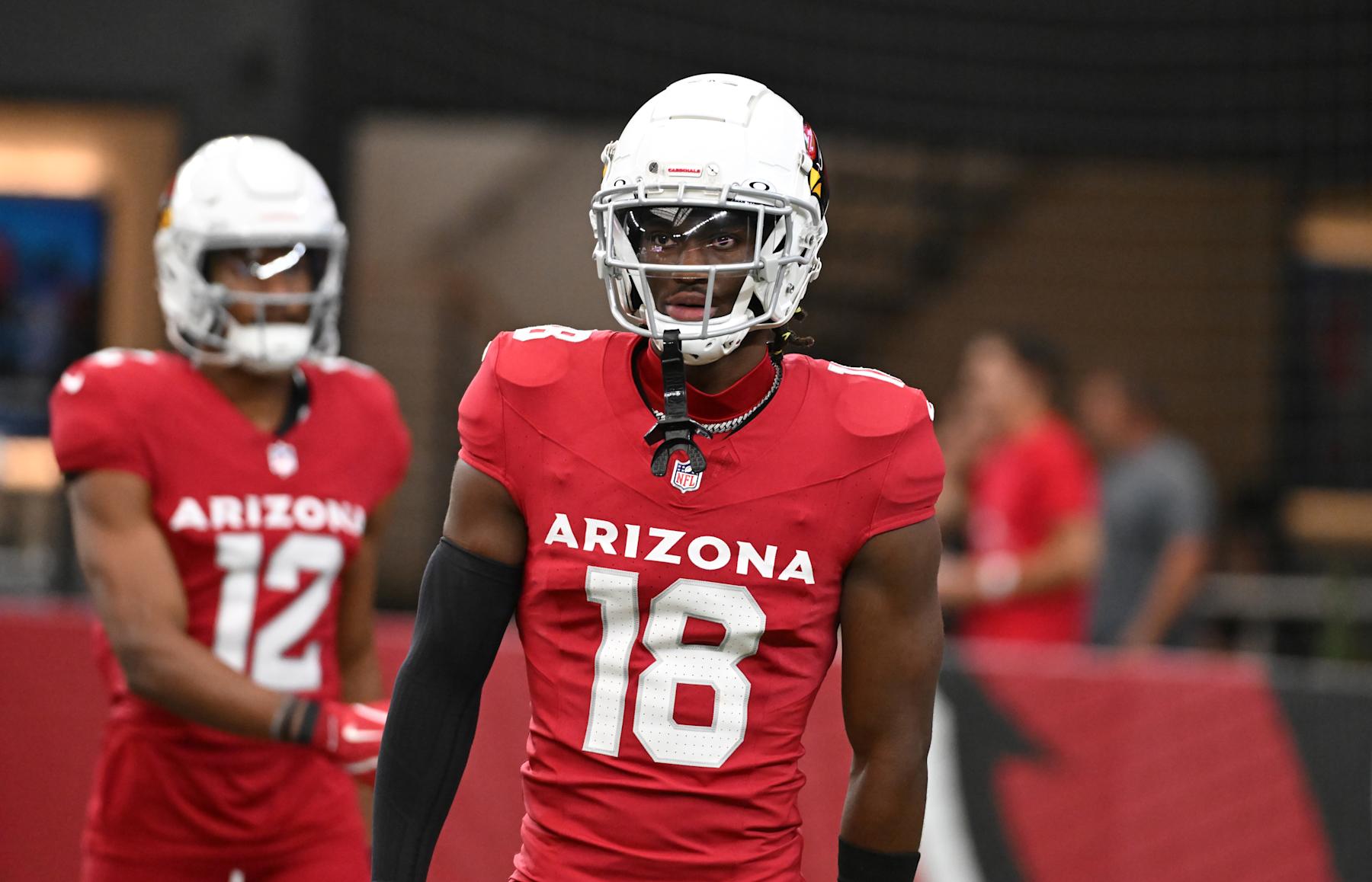 GLENDALE, ARIZONA - AUGUST 10: Marvin Harrison Jr #18 of the Arizona Cardinals prepares for a game against the New Orleans Saints at State Farm Stadium on August 10, 2024 in Glendale, Arizona.  (Photo by Norm Hall/Getty Images)