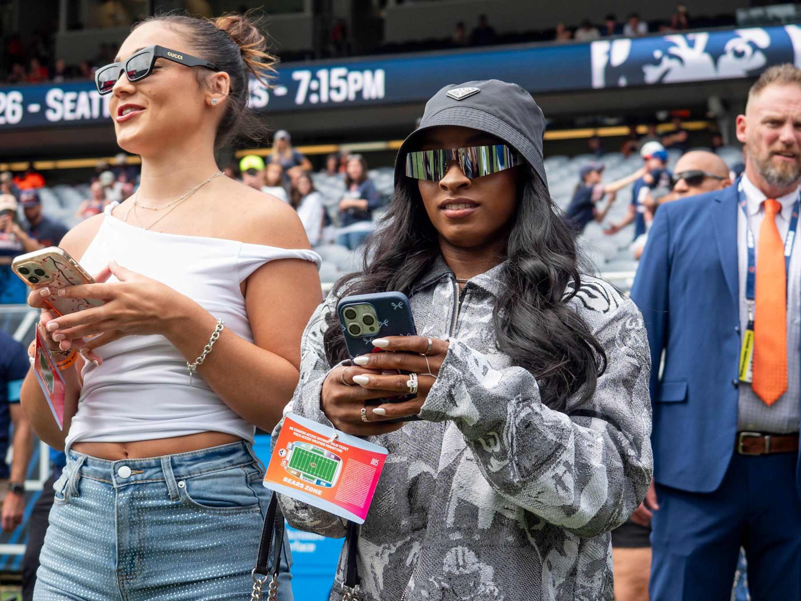 CHICAGO, IL - AUGUST 17: Team USA Olympic Gymnastics Gold Medalist Simone Biles watches the Chicago Bears warm up before a preseason game between the Cincinnati Bengals and the Chicago Bears on August 17, 2024, at Soldier Field in Chicago, Illinois.  (Photo by Joseph Weiser/Icon Sportswire via Getty Images)