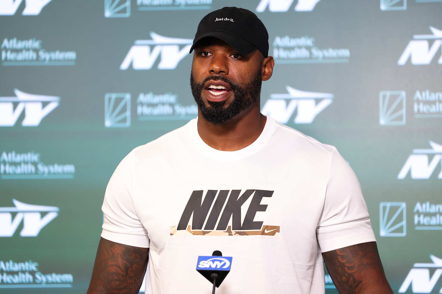 FLORHAM PARK, NEW JERSEY - JUNE 11: Tyron Smith #77 of the New York Jets speaks to the media during New York Jets Mandatory Minicamp at Atlantic Health Jets Training Center on June 11, 2024 in Florham Park, New Jersey.  (Photo by Luke Hales/Getty Images)