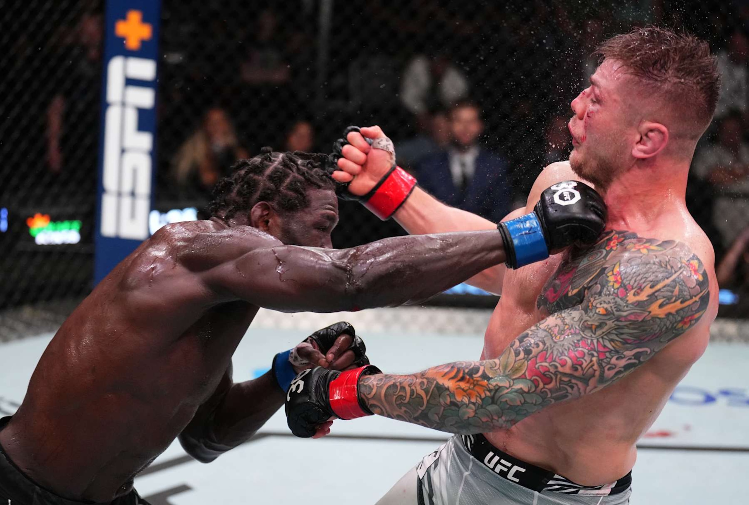 Jared Cannonier lands a punch against Marvin Vettori