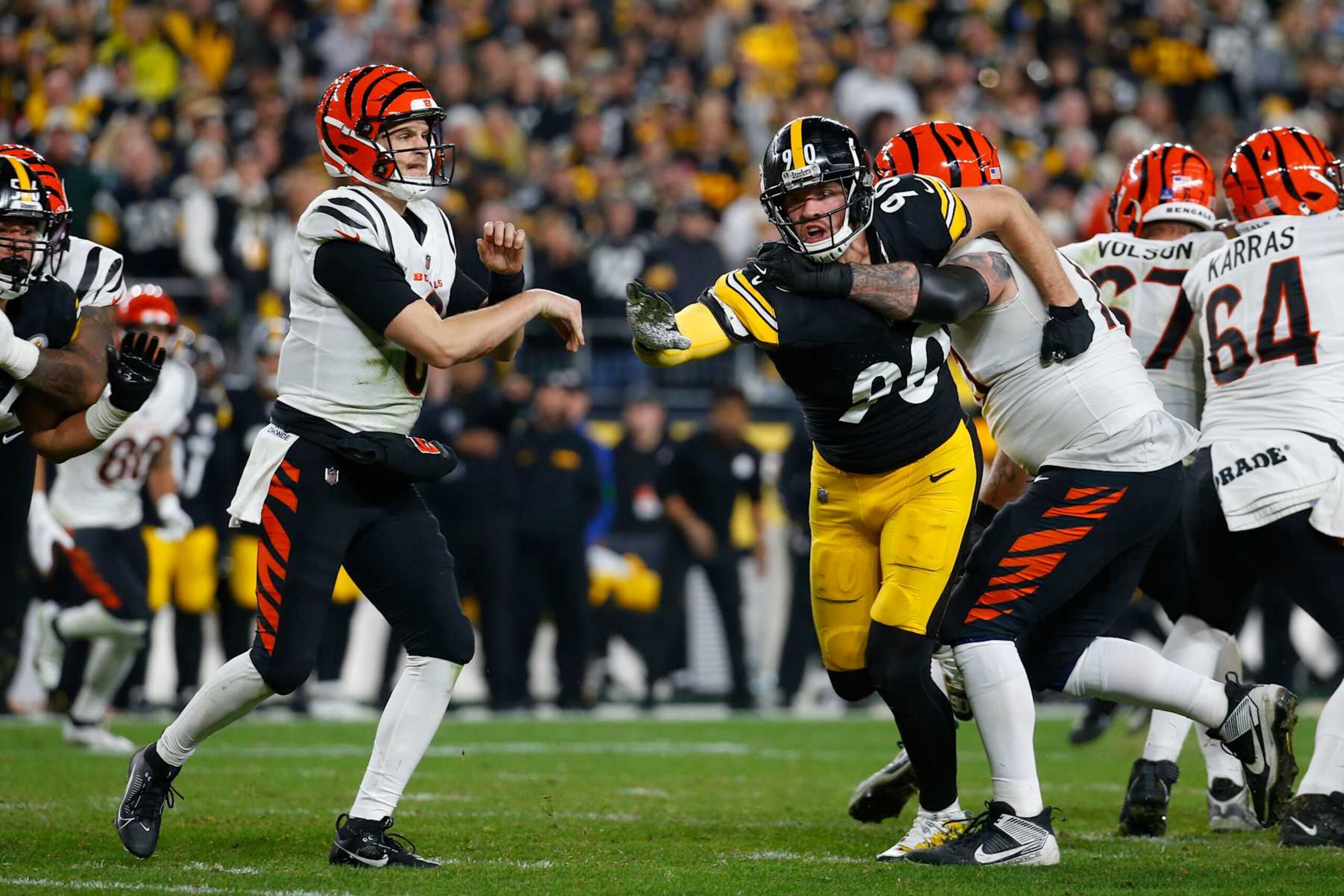 PITTSBURGH, PENNSYLVANIA - DECEMBER 23: Jake Browning #6 of the Cincinnati Bengals throws the ball under pressure by T.J. Watt #90 of the Pittsburgh Steelers during the fourth quarter of a game at Acrisure Stadium on December 23, 2023 in Pittsburgh, Pennsylvania. (Photo by Justin K. Aller/Getty Images)