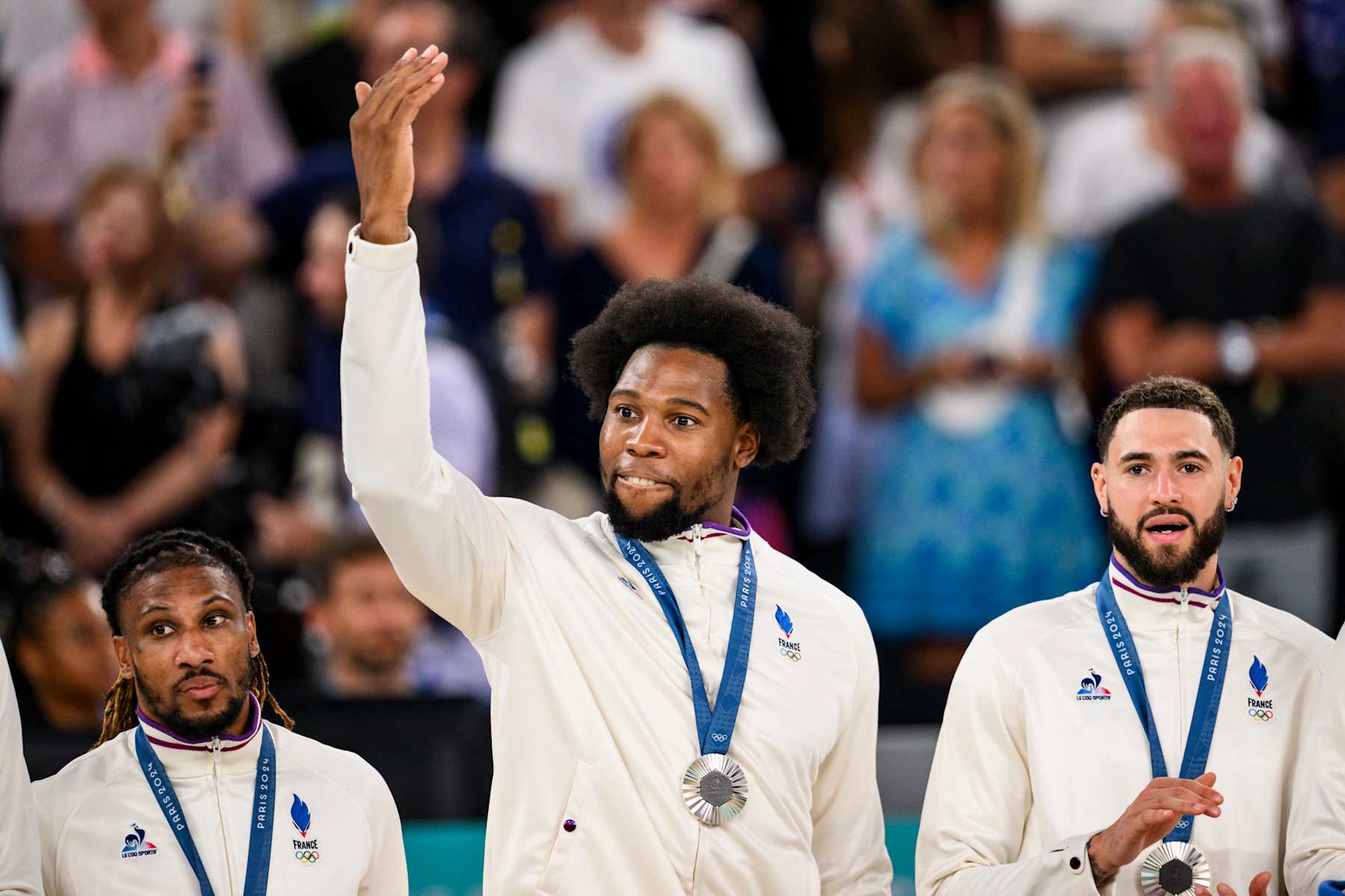 PARIS, FRANCE - AUGUST 11: Silver medalist Guerschon Yabusele of Team France celebrate on the podium during the Men's basketball medal ceremony on day fifteen of the Olympic Games Paris 2024 at the Bercy Arena on August 11, 2024 in Paris, France. (Photo by Tom Weller/VOIGT/GettyImages)