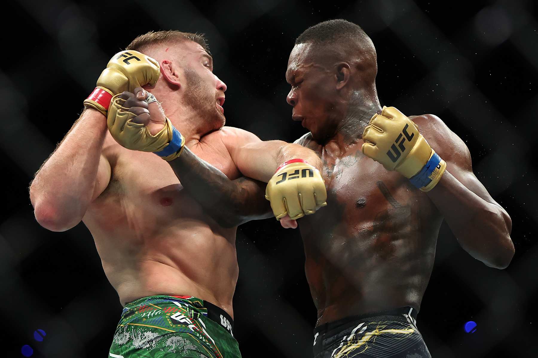 Dricus Du Plessis and Israel Adesanya trade punches
