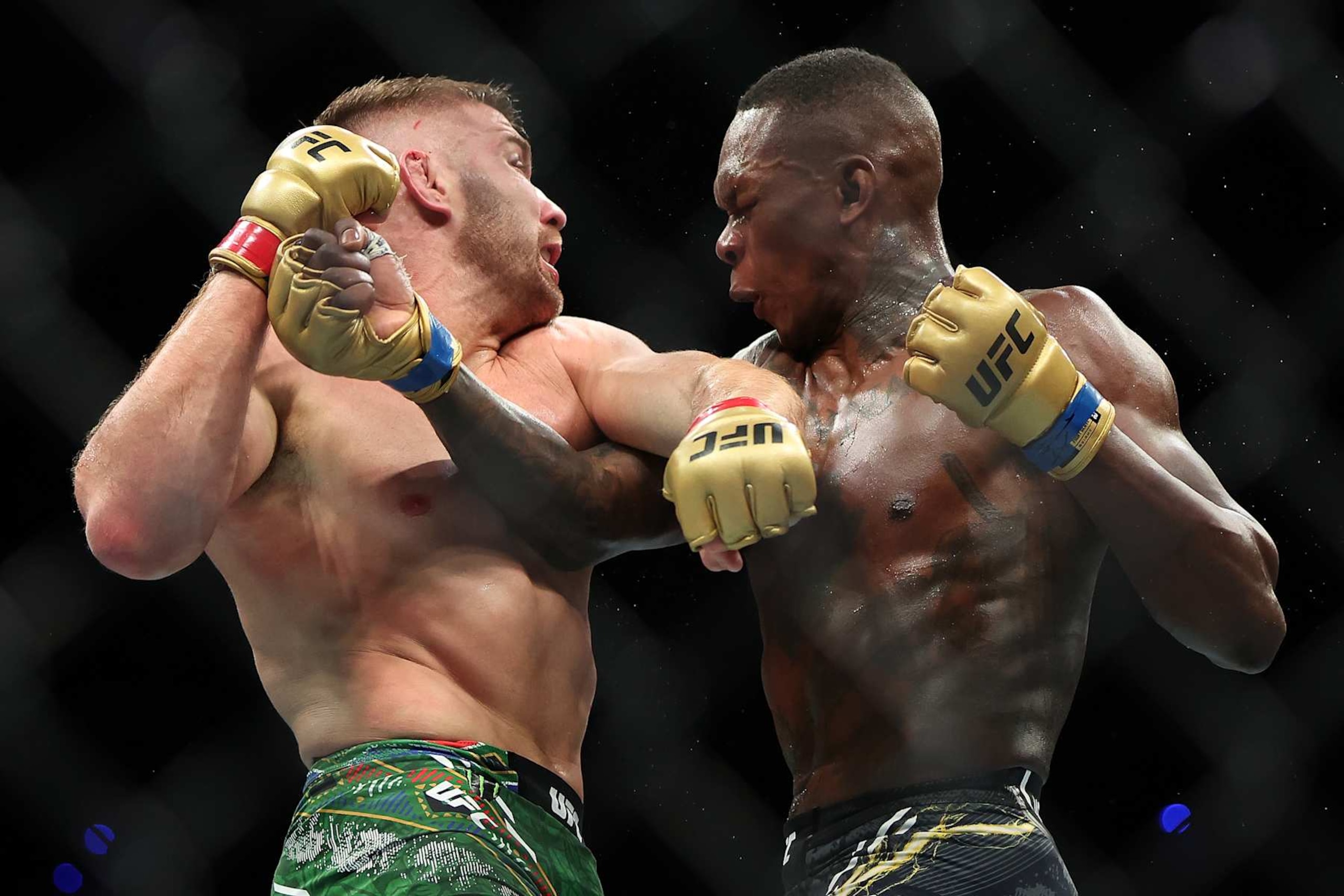 Dricus Du Plessis and Israel Adesanya trade punches