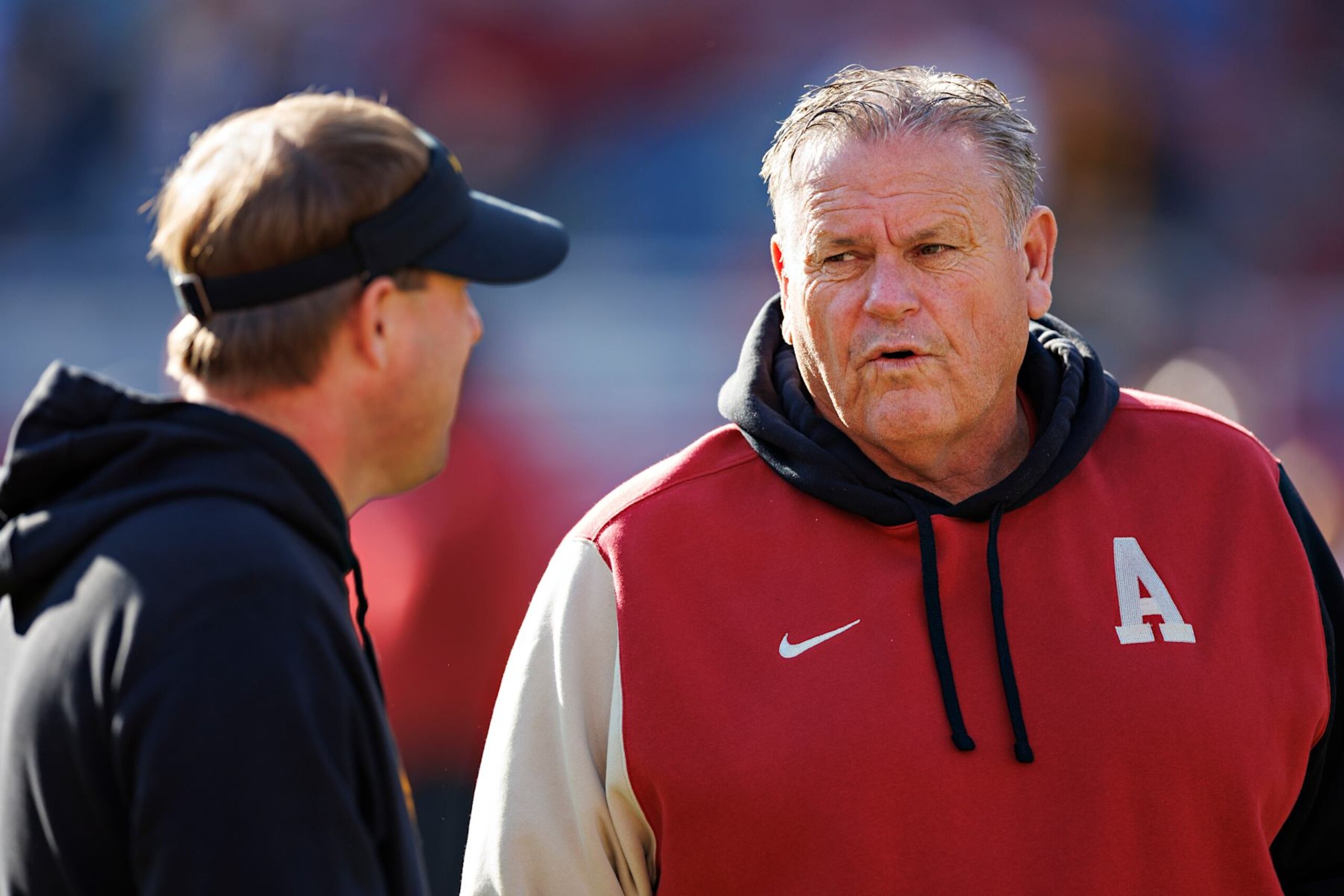 FAYETTEVILLE, ARKANSAS - NOVEMBER 24: Head Coach Sam Pittman of the Arkansas Razorbacks talks on the field before the game with Head Coach Eli Drinkwitz of the Missouri Tigers at Donald W. Reynolds Razorback Stadium on November 24, 2023 in Fayetteville, Arkansas. The Tigers defeated the Razorbacks 48-14. (Photo by Wesley Hitt/Getty Images) FAYETTEVILLE, ARKANSAS - NOVEMBER 24: Head Coach Sam Pittman of the Arkansas Razorbacks talks on the field before the game with Head Coach Eli Drinkwitz of the Missouri Tigers at Donald W. Reynolds Razorback Stadium on November 24, 2023 in Fayetteville, Arkansas. The Tigers defeated the Razorbacks 48-14. (Photo by Wesley Hitt/Getty Images)