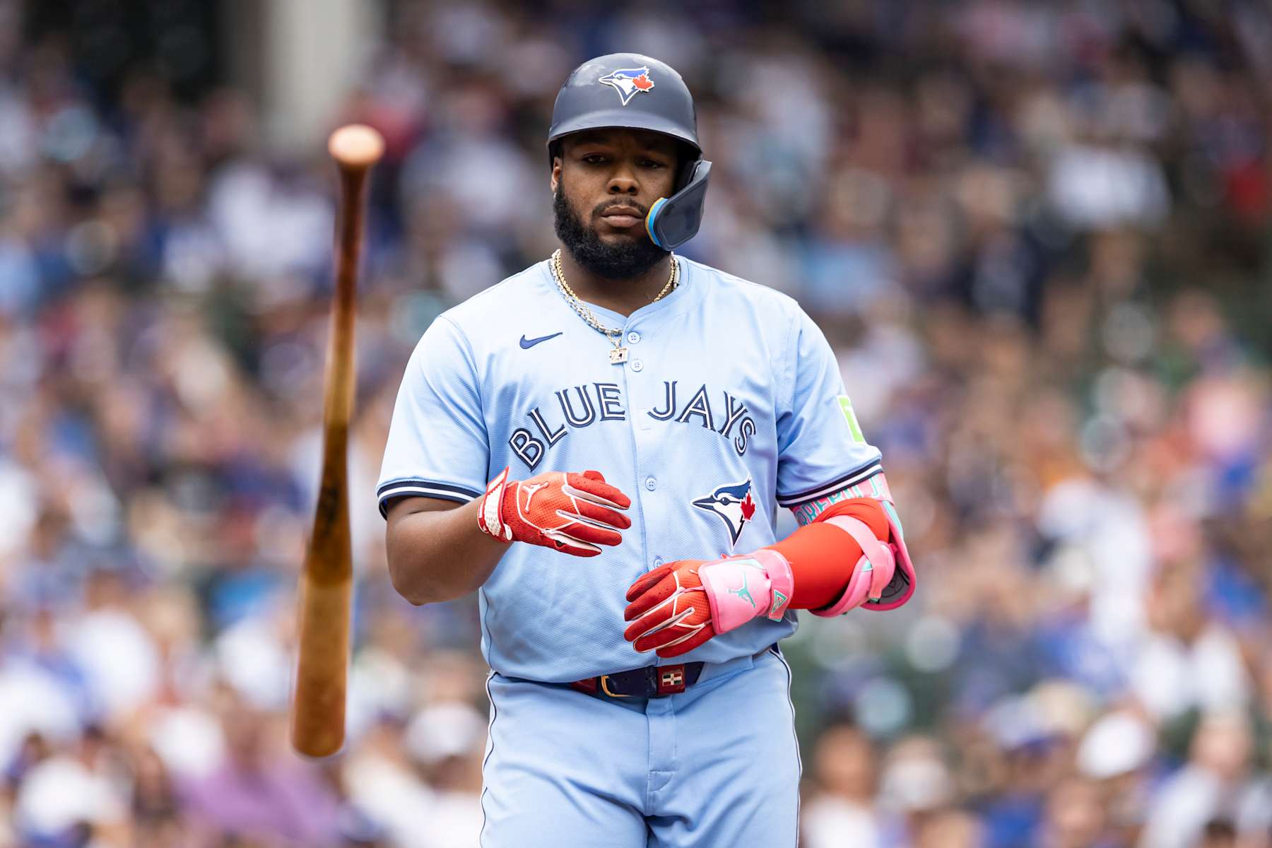 CHICAGO, ILLINOIS - AUGUST 18: Vladimir Guerrero Jr. #27 of the Toronto Blue Jays flips his bat after being walked in the first inning against the Chicago Cubs at Wrigley Field on August 18, 2024 in Chicago, Illinois. (Photo by Griffin Quinn/Getty Images)