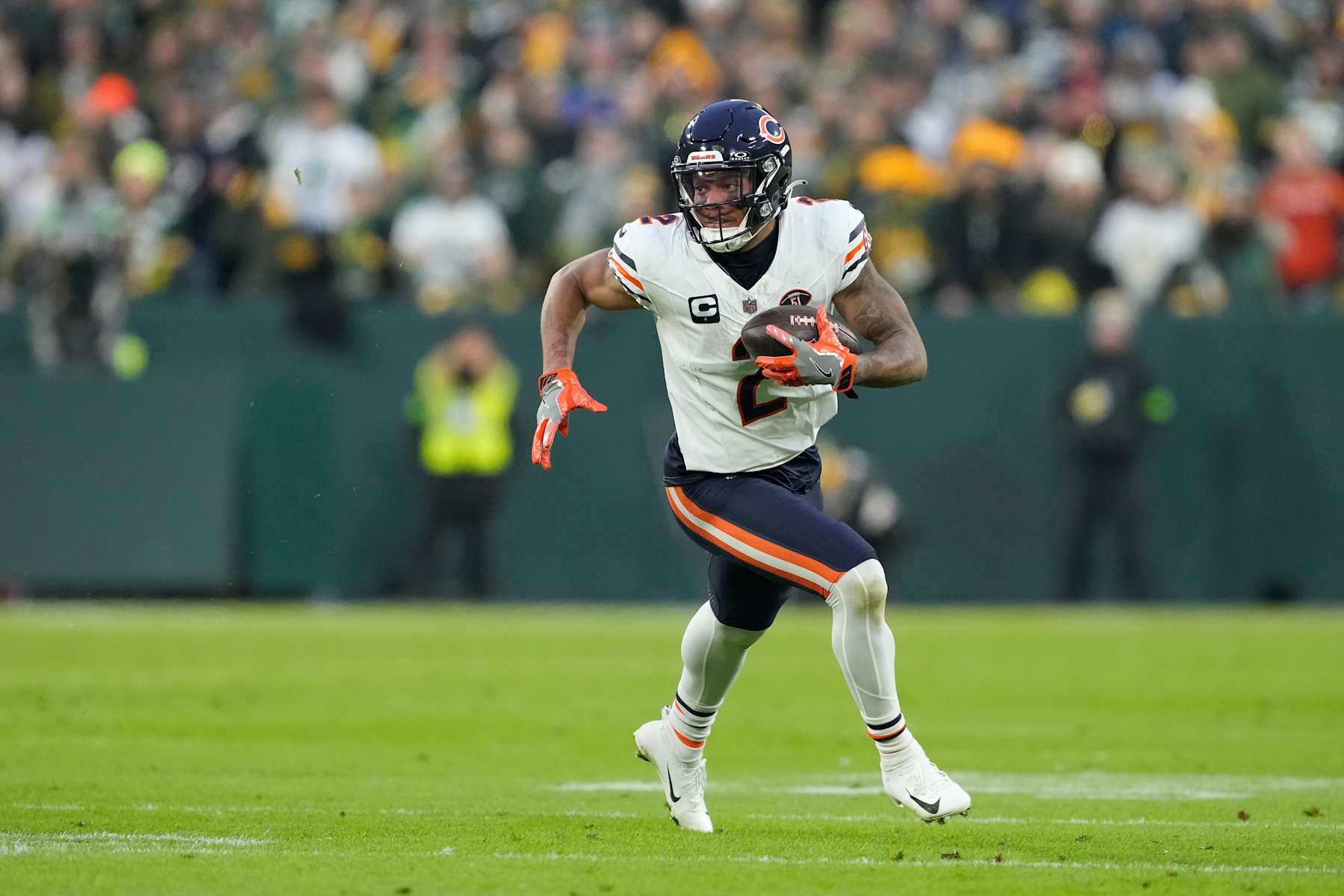 GREEN BAY, WISCONSIN - JANUARY 07: DJ Moore #2 of the Chicago Bears runs with the ball in the first half against the Green Bay Packers at Lambeau Field on January 07, 2024 in Green Bay, Wisconsin. (Photo by Patrick McDermott/Getty Images)
