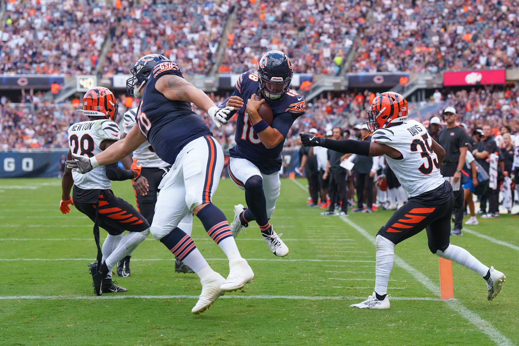 CHICAGO, IL - AUGUST 17: Caleb Williams #18 of the Chicago Bears runs into the end zone during the second quarter during the second quarter of an NFL preseason football game against the Cincinnati Bengals, at Soldier Field on August 17, 2024 in Chicago, Illinois. (Photo by Todd Rosenberg/Getty Images)