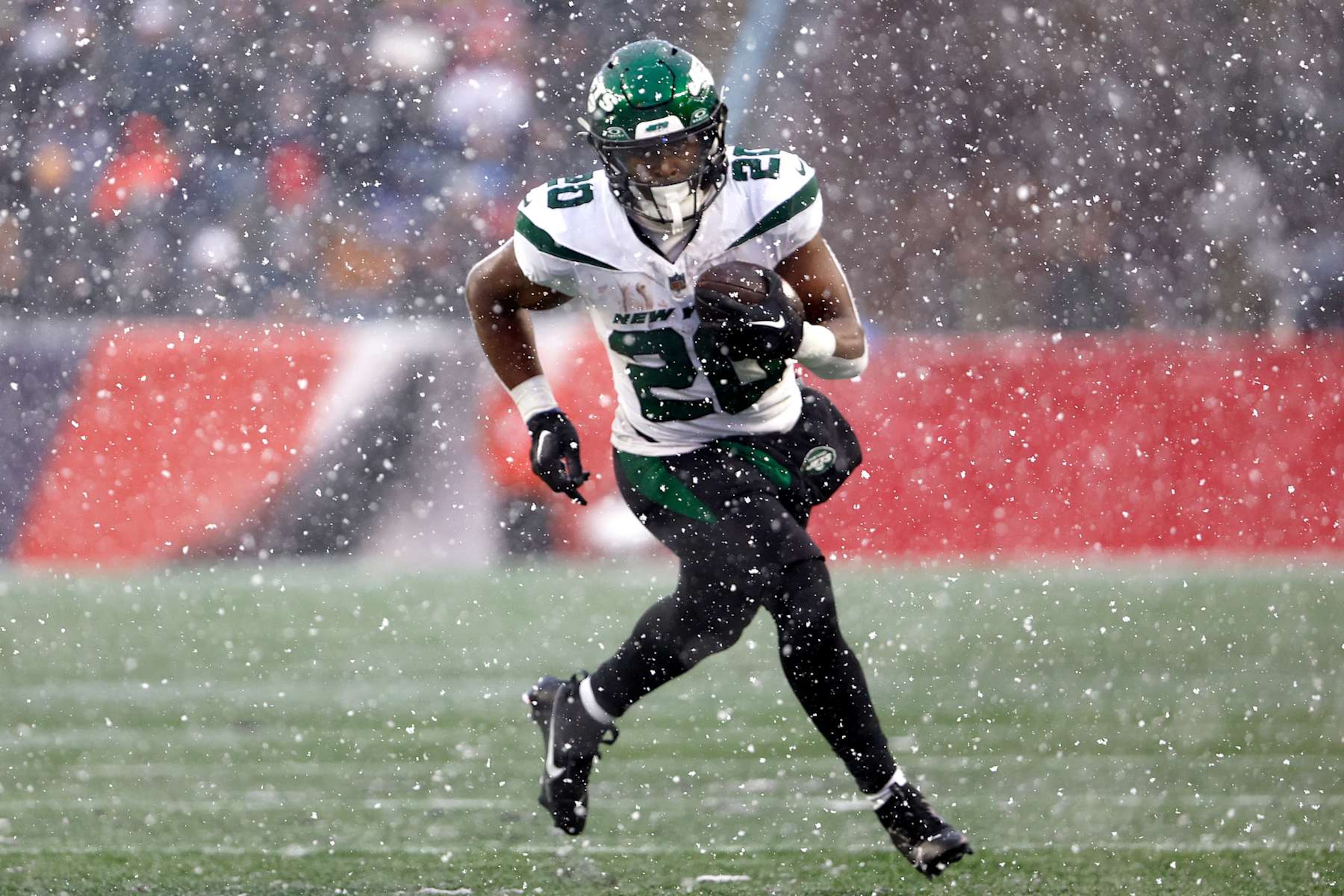 FOXBOROUGH, MASSACHUSETTS - JANUARY 07: Breece Hall #20 of the New York Jets runs the ball in the first half at Gillette Stadium on January 07, 2024 in Foxborough, Massachusetts. (Photo by Winslow Townson/Getty Images)