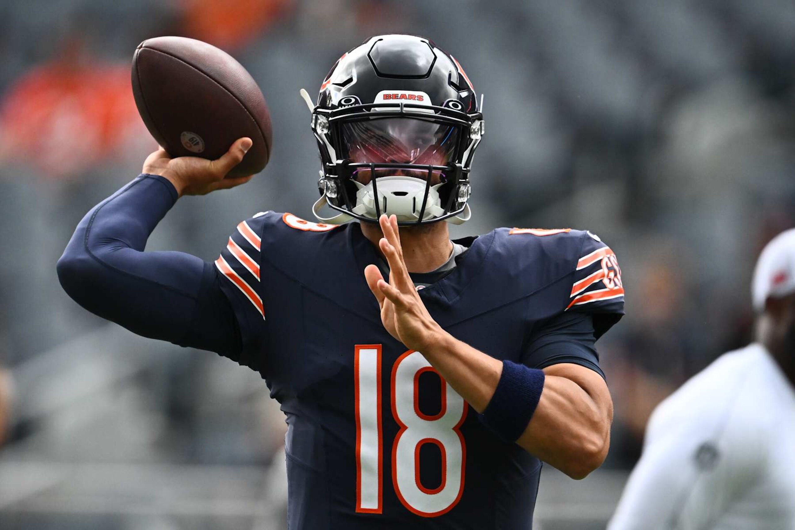 CHICAGO, ILLINOIS - AUGUST 17: Caleb Williams #18 of the Chicago Bears warms up before a preseason game against the Cincinnati Bengals at Soldier Field on August 17, 2024 in Chicago, Illinois. (Photo by Quinn Harris/Getty Images)