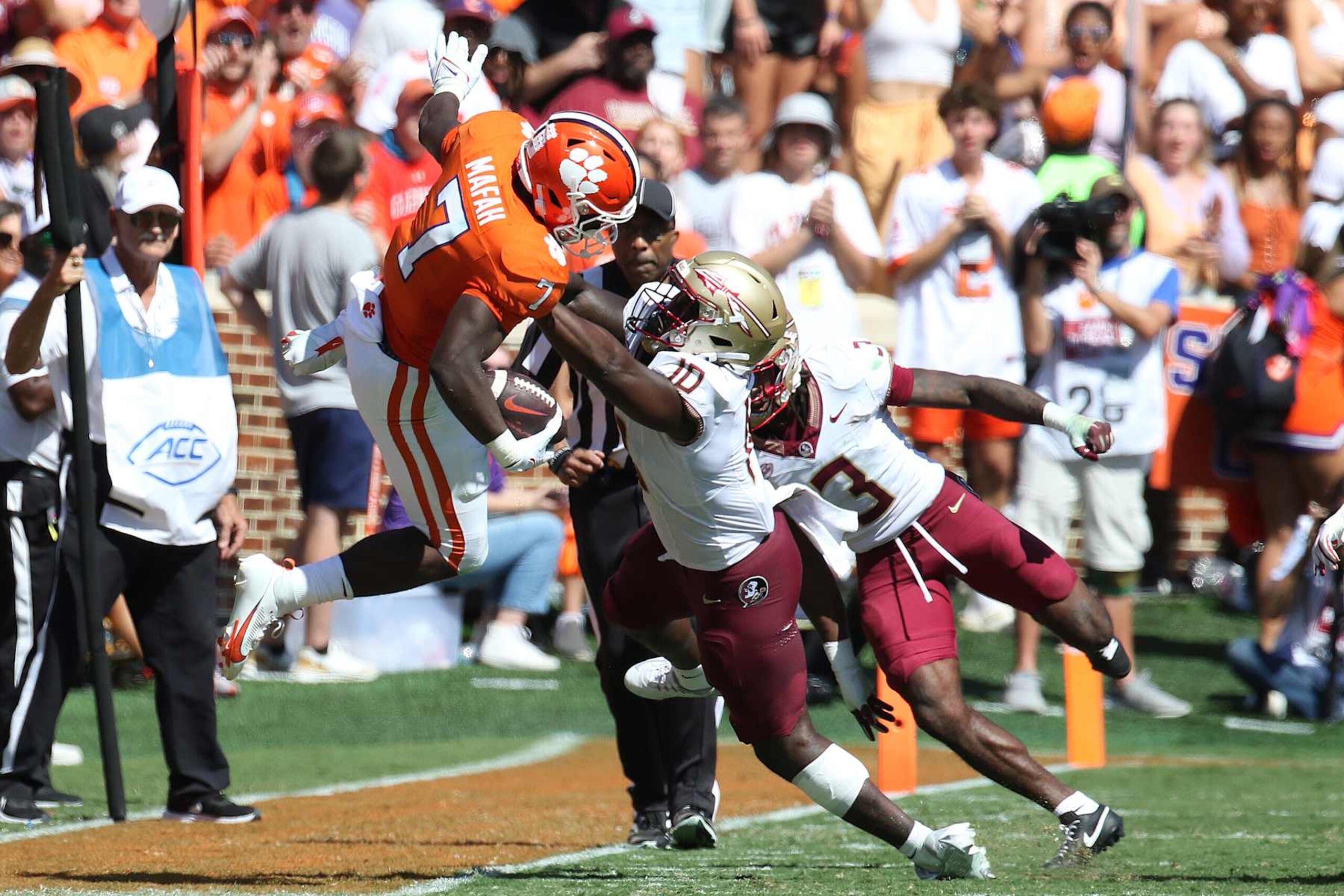 CLEMSON, SC - SEPTEMBER 23: Clemson Tigers running back Phil Mafah (7) tackled by Florida State Seminoles linebacker DJ Lundy (10) during a college football game between the Florida State Seminoles and the Clemson Tigers on September 23, 2023, at Clemson Memorial Stadium in Clemson, S.C.  (Photo by John Byrum/Icon Sportswire via Getty Images)