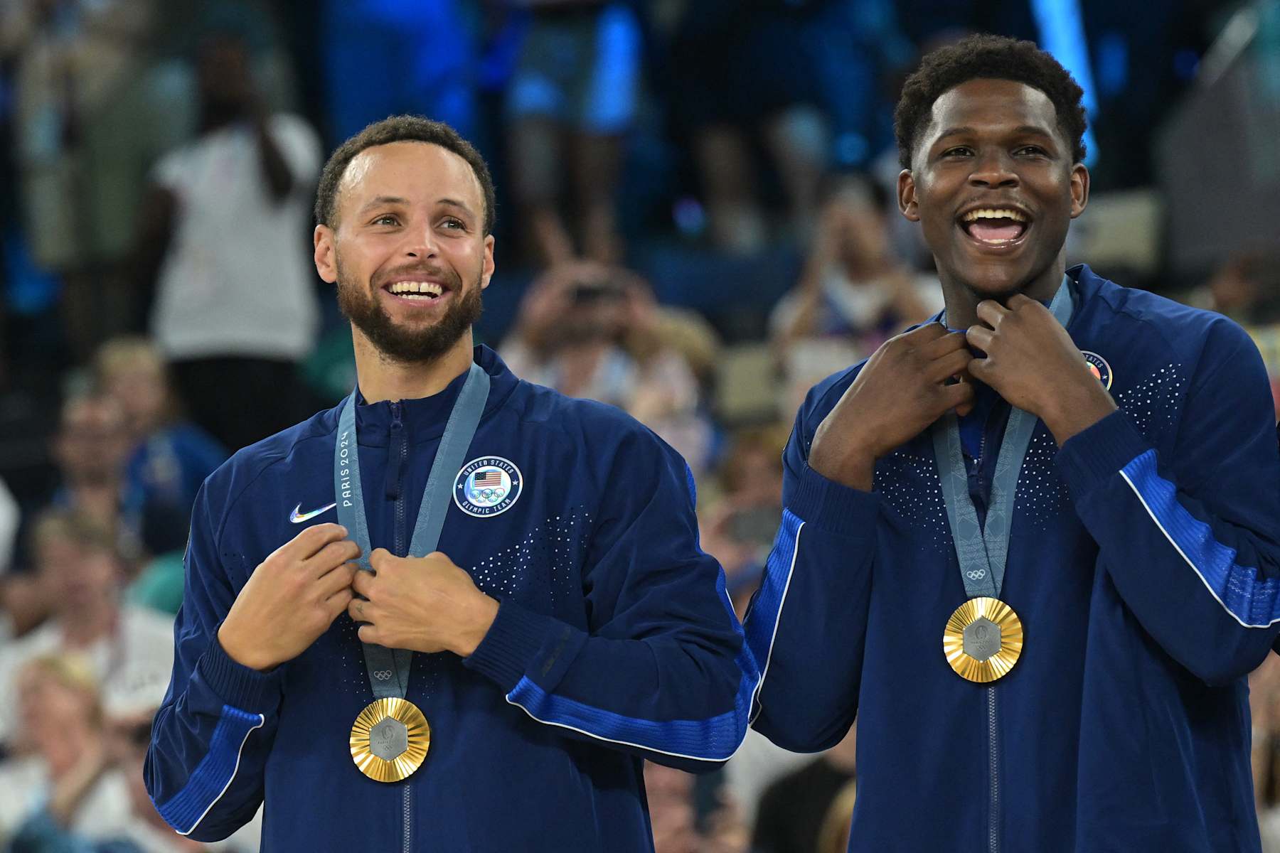 Gold medallists USA's #04 Stephen Curry (L) and USA's #05 Anthony Edwards pose on the podium after the men's Gold Medal basketball match between France and USA during the Paris 2024 Olympic Games at the Bercy  Arena in Paris on August 10, 2024. (Photo by Damien MEYER / AFP) (Photo by DAMIEN MEYER/AFP via Getty Images)