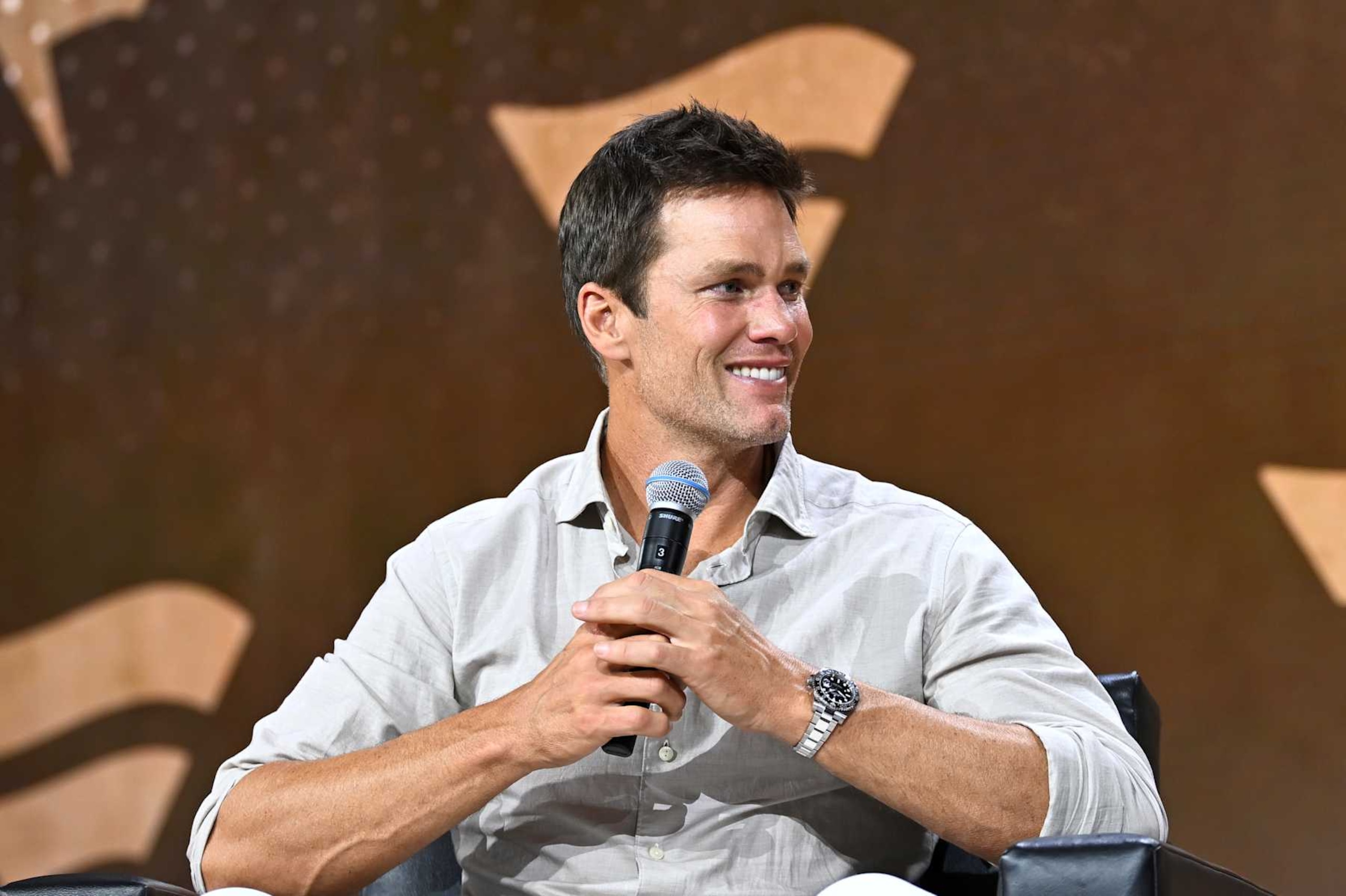 NEW YORK, NEW YORK - AUGUST 16: Tom Brady speaks at the Fanatics Fest NYC 2024 at Jacob Javits Center on August 16, 2024 in New York City.  (Photo by Roy Rochlin/Getty Images for Fanatics)