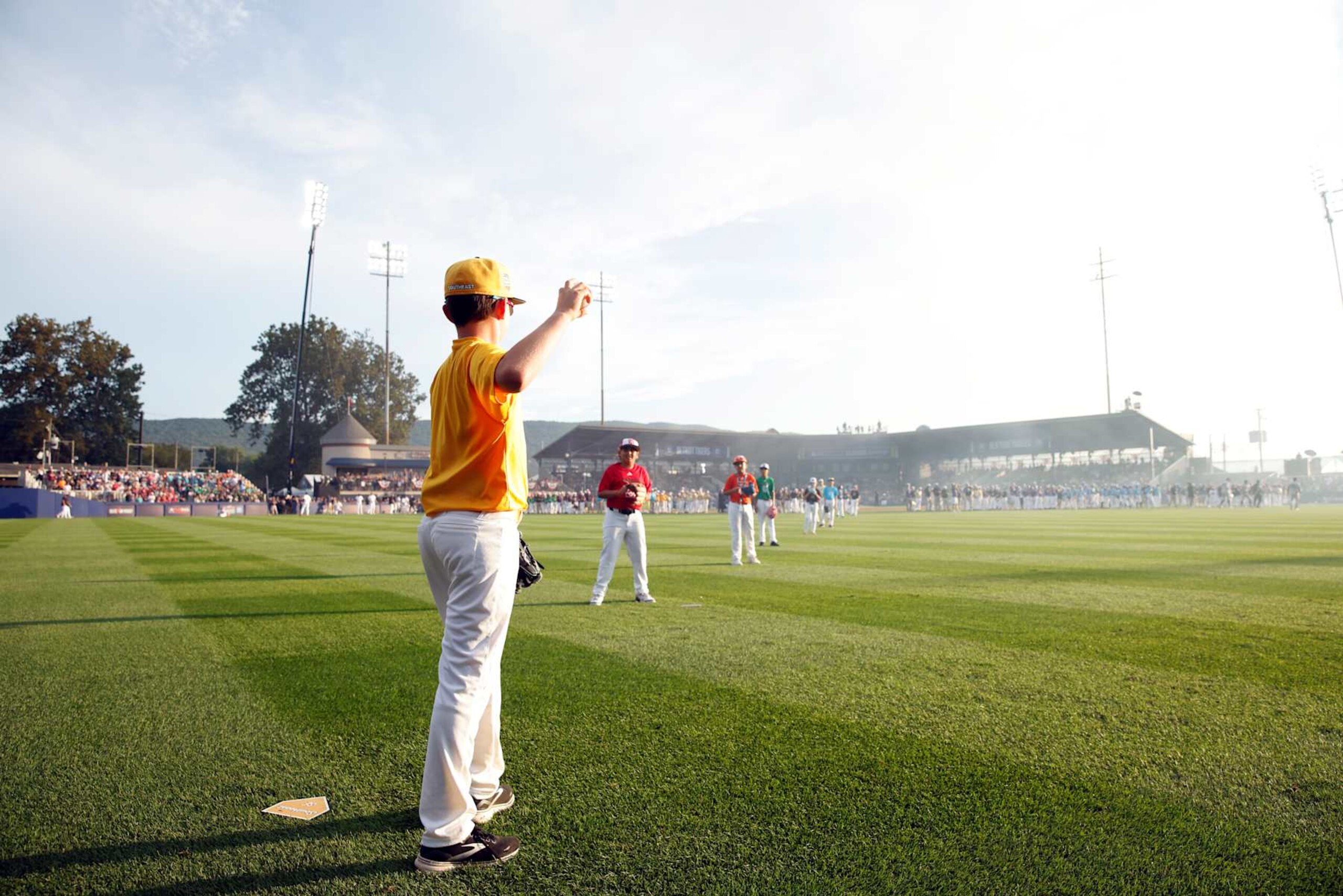 WILLIAMSPORT , PA - AUGUST 18:  Participants in the 2024 Little League International World Series throw out tthe ceremonial first pitch prior to the 2024 Little League Classic game between the New York Yankees and the Detroit Tigers at Journey Bank Ballpark at Historic Bowman Field on Sunday, August 18, 2024 in Williamsport , Pennsylvania. (Photo by Rob Tringali/MLB Photos via Getty Images)