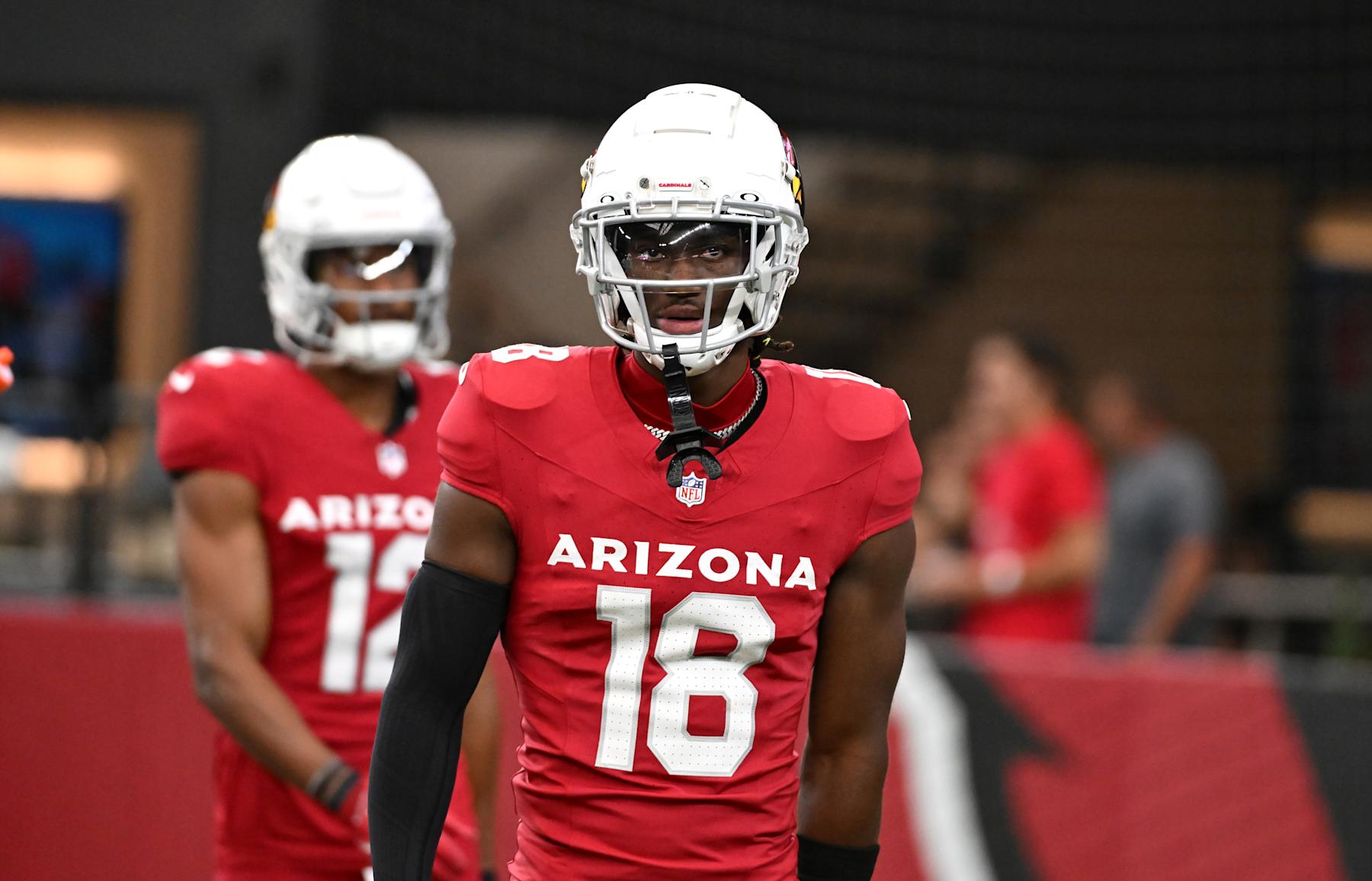 GLENDALE, ARIZONA - AUGUST 10: Marvin Harrison Jr #18 of the Arizona Cardinals prepares for a preseason game against the New Orleans Saints at State Farm Stadium on August 10, 2024 in Glendale, Arizona.  (Photo by Norm Hall/Getty Images)