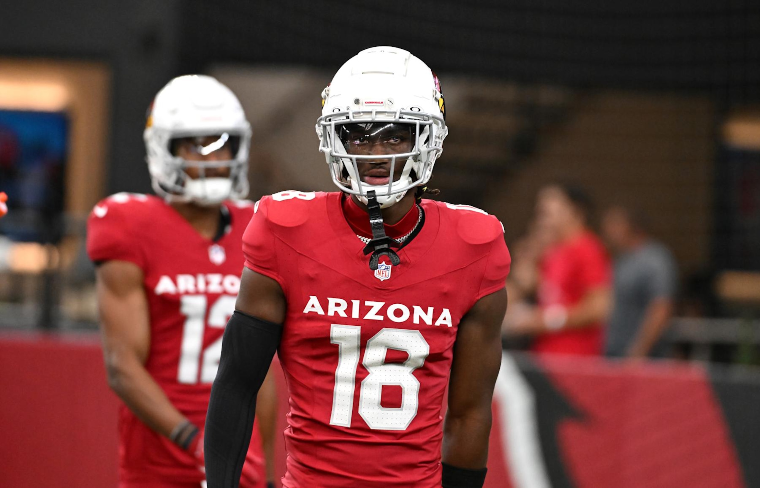 GLENDALE, ARIZONA - AUGUST 10: Marvin Harrison Jr #18 of the Arizona Cardinals prepares for a preseason game against the New Orleans Saints at State Farm Stadium on August 10, 2024 in Glendale, Arizona.  (Photo by Norm Hall/Getty Images)