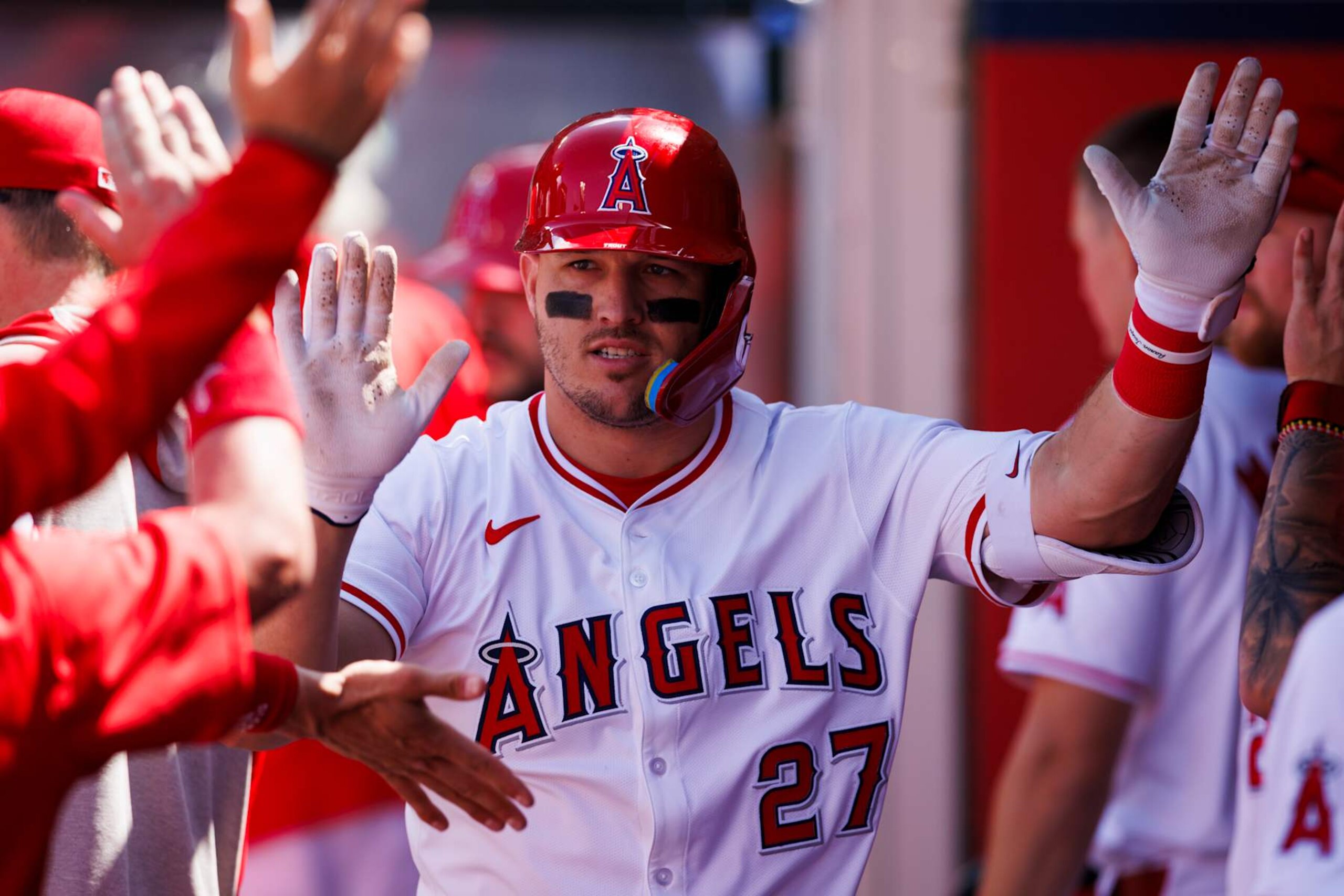 ANAHEIM, CALIFORNIA - APRIL 24: Mike Trout #27 of the Los Angeles Angels celebrates his home run with teammates in the dugout during a MLB baseball game against the Baltimore Orioles at Angel Stadium of Anaheim on April 24, 2024 in Anaheim, California. (Photo by Ric Tapia/Getty Images) ANAHEIM, CALIFORNIA - APRIL 24: Mike Trout #27 of the Los Angeles Angels celebrates his home run with teammates in the dugout during a MLB baseball game against the Baltimore Orioles at Angel Stadium of Anaheim on April 24, 2024 in Anaheim, California. (Photo by Ric Tapia/Getty Images)