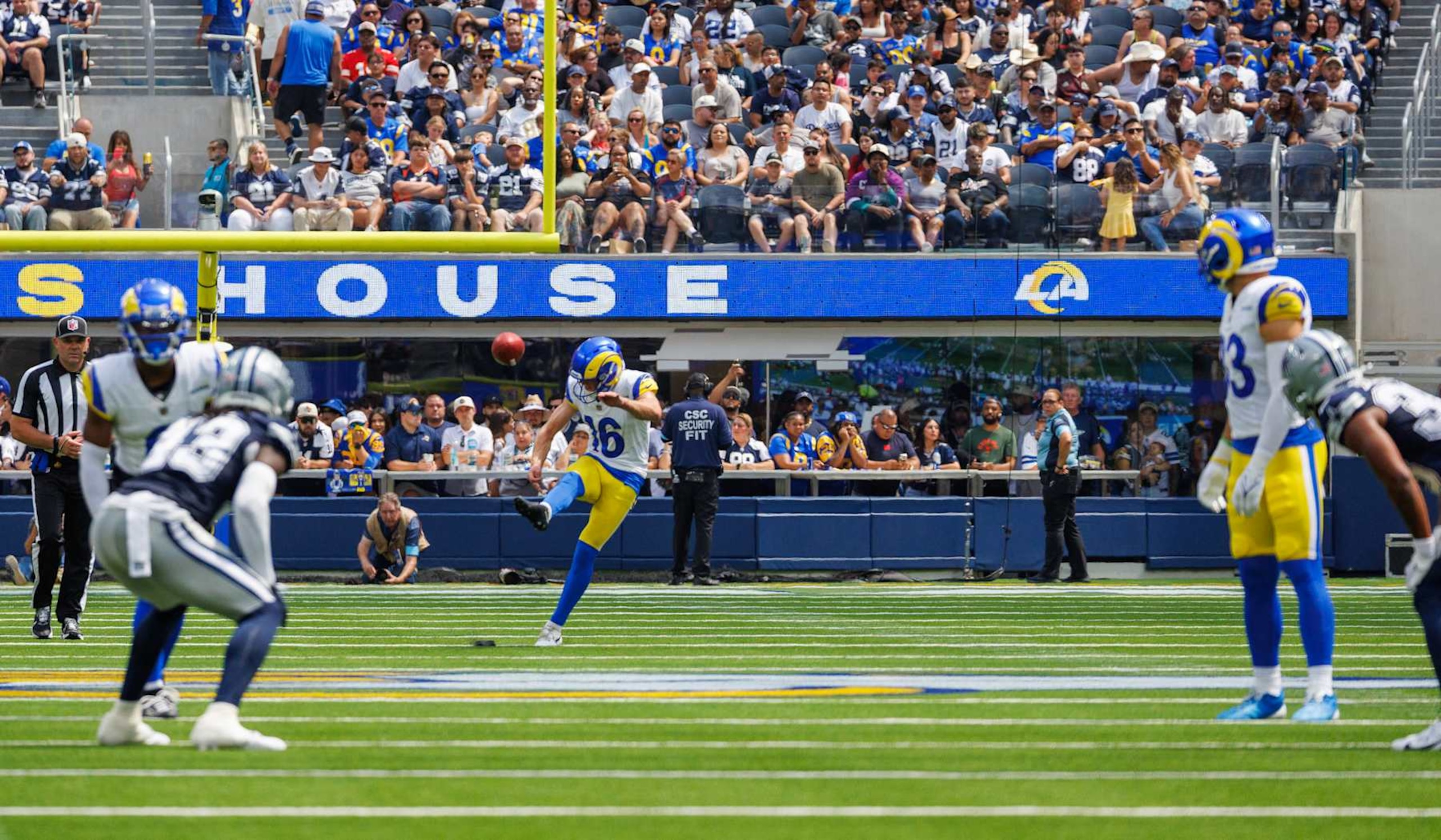 INGLEWOOD, CA - AUGUST 11, 2024:  Los Angeles Rams place kicker Joshua Karty (16) kicks-off to the Dallas Cowboys with the new NFL kick-off rules are in place   at So-Fi  Stadium August 11,  2024 in Inglewood, California. (Gina Ferazzi / Los Angeles Times via Getty Images)