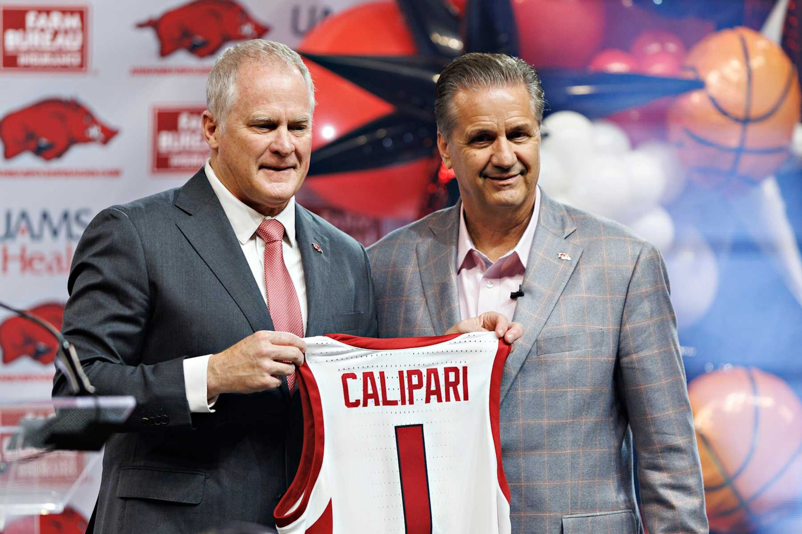 FAYETTEVILLE, ARKANSAS - APRIL 10: New head coach John Calipari of the Arkansas Razorbacks poses with Athletic Director Hunter Yurachek as he is introduced to the fans and the media at Bud Walton Arena on April 10, 2024 in Fayetteville, Arkansas. (Photo by Wesley Hitt/Getty Images)