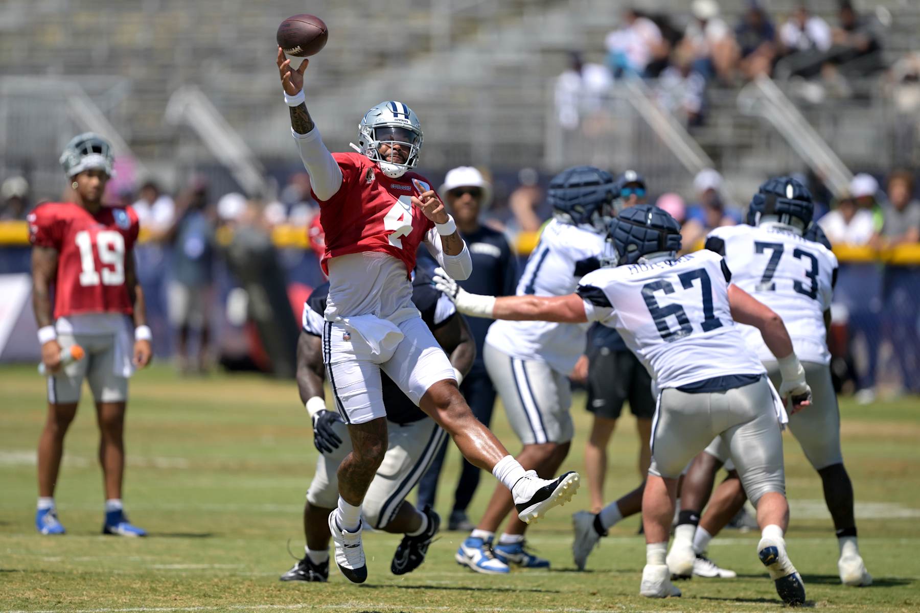 OXNARD, CALIFORNIA - AUGUST 6: Dak Prescott #4 of the Dallas Cowboys participates in drills during NFL training camp at River Ridge Fields on August 6, 2024 in Oxnard, California. (Photo by Jayne Kamin-Oncea/Getty Images)