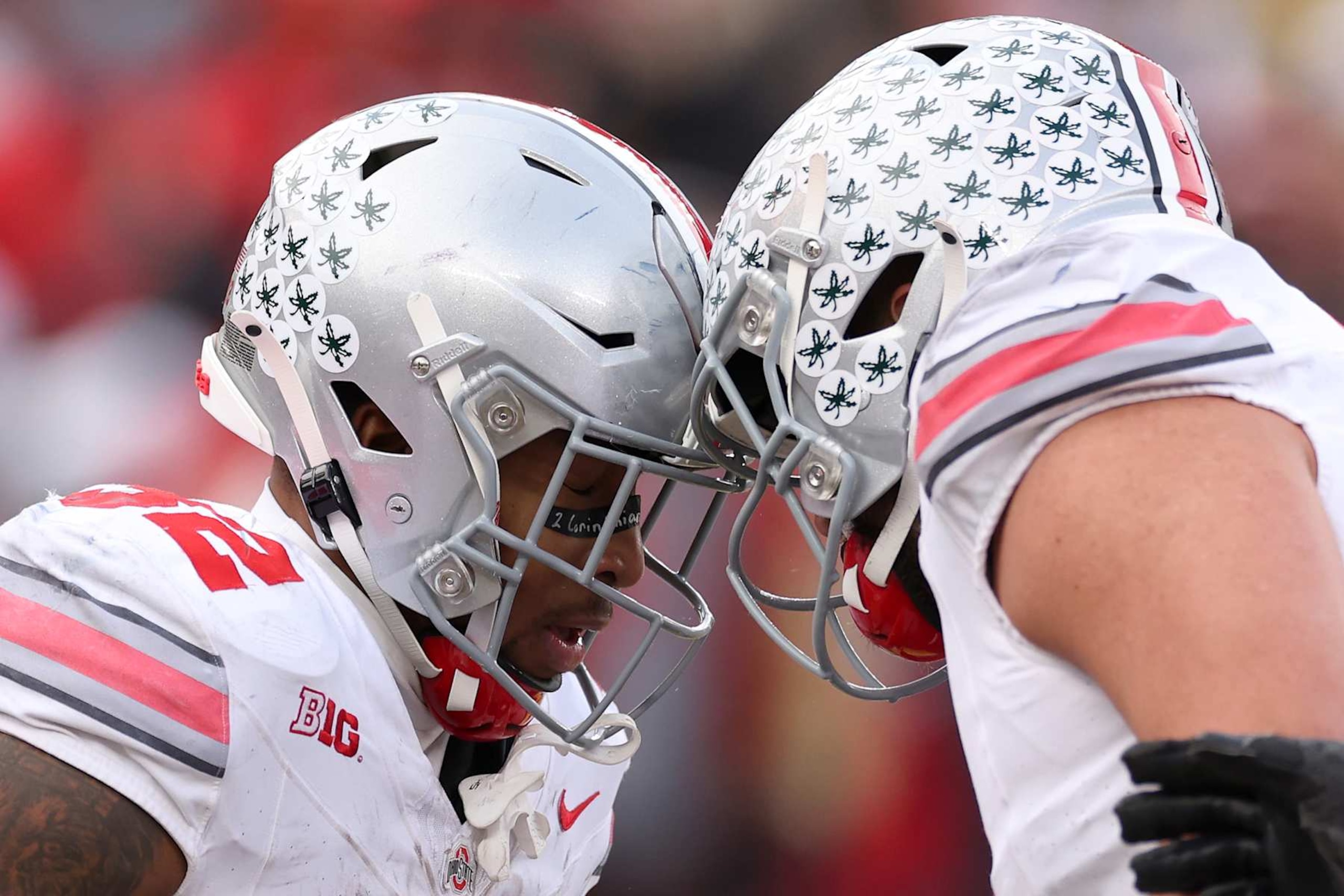 ANN ARBOR, MICHIGAN - NOVEMBER 25: TreVeyon Henderson #32 of the Ohio State Buckeyes celebrates with teammates after scoring a touchdown against the Michigan Wolverines during the third quarter in the game at Michigan Stadium on November 25, 2023 in Ann Arbor, Michigan. (Photo by Ezra Shaw/Getty Images)