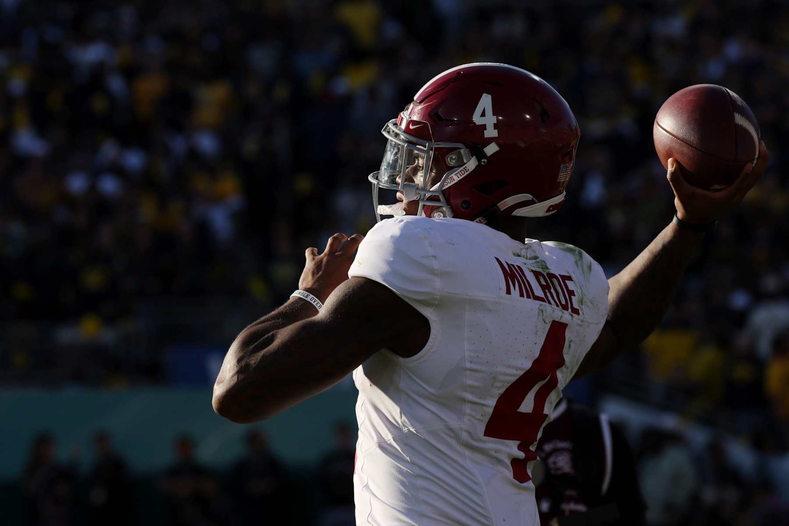 PASADENA, CALIFORNIA - JANUARY 01: Jalen Milroe #4 of the Alabama Crimson Tide warms up in the second quarter against the Michigan Wolverines during the CFP Semifinal Rose Bowl Game at Rose Bowl Stadium on January 01, 2024 in Pasadena, California. (Photo by Harry How/Getty Images)