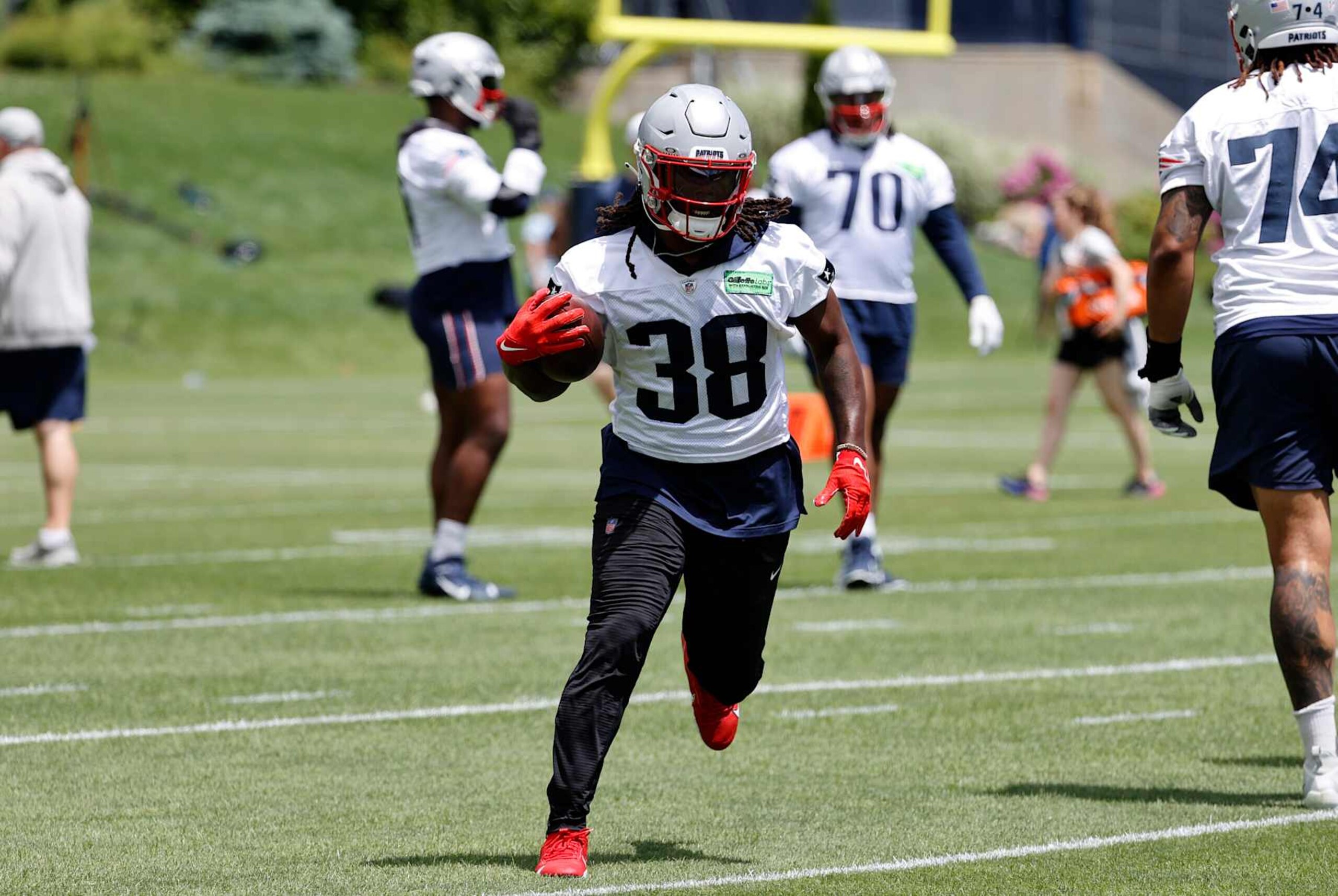 FOXBOROUGH, MA - MAY 29: New England Patriots running back Rhamondre Stevenson (38) carries during New England Patriots Optional Team Activities on May 29, 2024, at Gillette Stadium in Foxborough, Massachusetts. (Photo by Fred Kfoury III/Icon Sportswire via Getty Images)