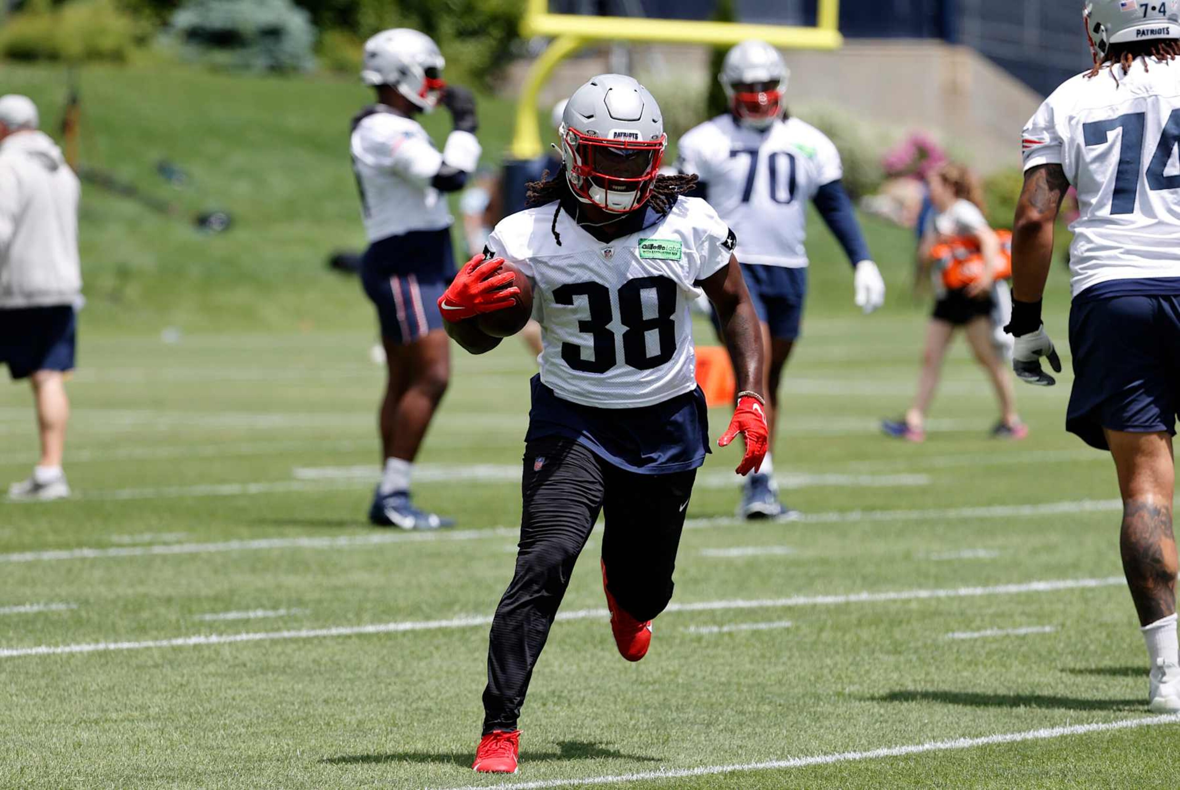 FOXBOROUGH, MA - MAY 29: New England Patriots running back Rhamondre Stevenson (38) carries during New England Patriots Optional Team Activities on May 29, 2024, at Gillette Stadium in Foxborough, Massachusetts. (Photo by Fred Kfoury III/Icon Sportswire via Getty Images) FOXBOROUGH, MA - MAY 29: New England Patriots running back Rhamondre Stevenson (38) carries during New England Patriots Optional Team Activities on May 29, 2024, at Gillette Stadium in Foxborough, Massachusetts. (Photo by Fred Kfoury III/Icon Sportswire via Getty Images)