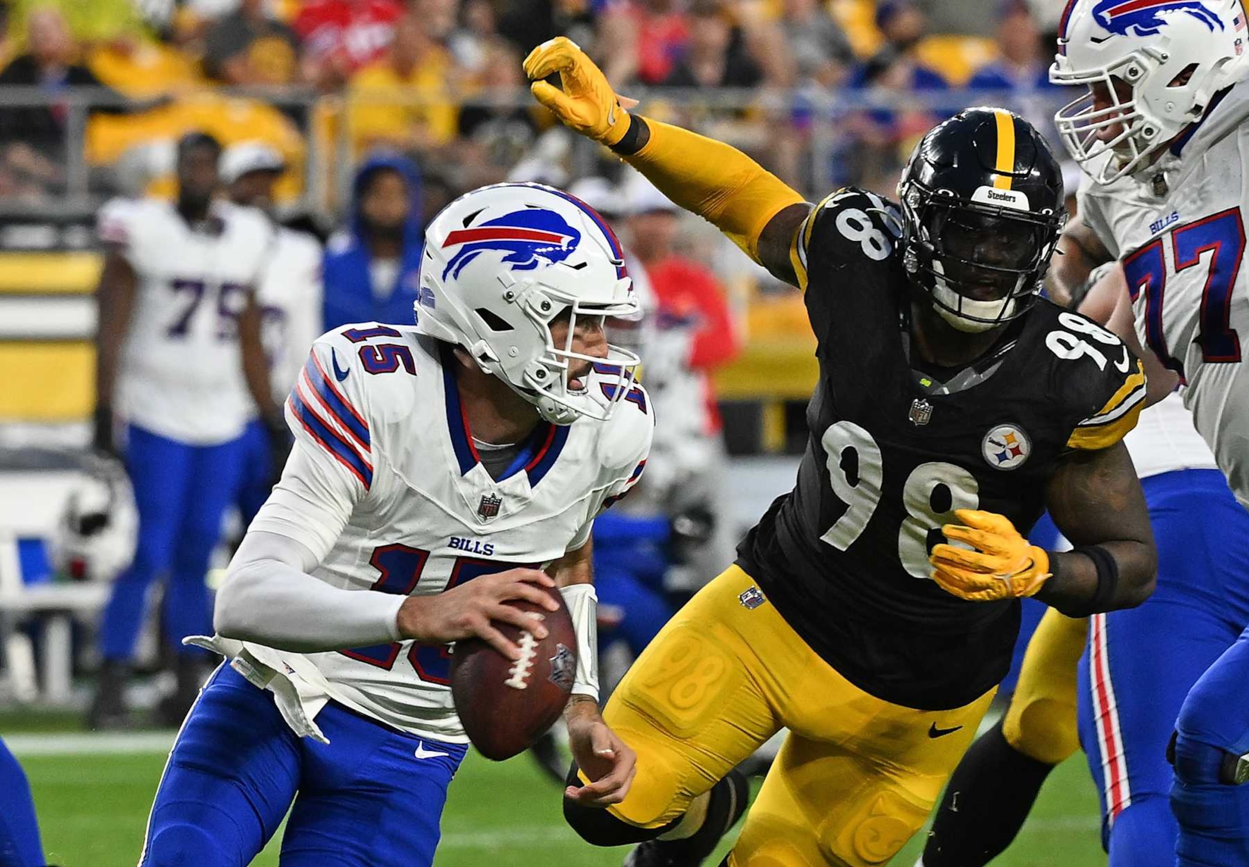 PITTSBURGH, PENNSYLVANIA - AUGUST 17: Ben DiNucci #15 of the Buffalo Bills scrambles under pressure from DeMarvin Leal #98 of the Pittsburgh Steelers in the second quarter during the preseason game at Acrisure Stadium on August 17, 2024 in Pittsburgh, Pennsylvania. (Photo by Justin Berl/Getty Images) PITTSBURGH, PENNSYLVANIA - AUGUST 17: Ben DiNucci #15 of the Buffalo Bills scrambles under pressure from DeMarvin Leal #98 of the Pittsburgh Steelers in the second quarter during the preseason game at Acrisure Stadium on August 17, 2024 in Pittsburgh, Pennsylvania. (Photo by Justin Berl/Getty Images)