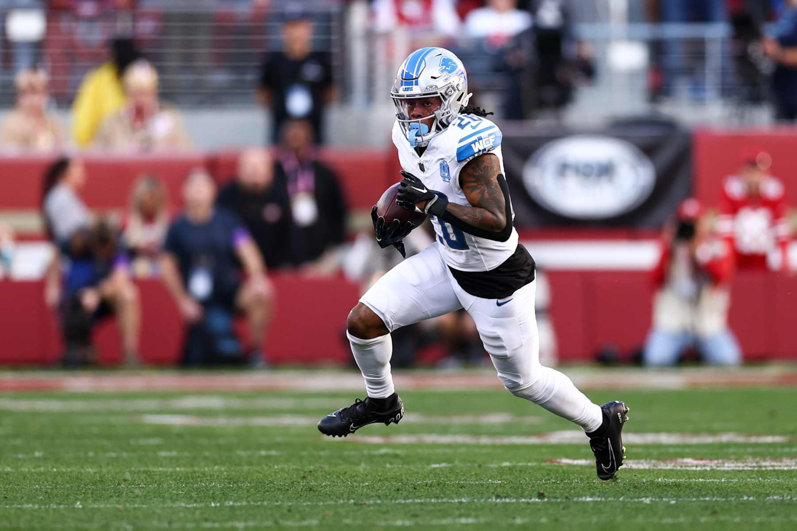 SANTA CLARA, CA - JANUARY 28: Jahmyr Gibbs #26 of the Detroit Lions carries the ball during the NFC Championship NFL football game against the San Francisco 49ers at Levi's Stadium on January 28, 2024 in Santa Clara, California. (Photo by Kevin Sabitus/Getty Images)