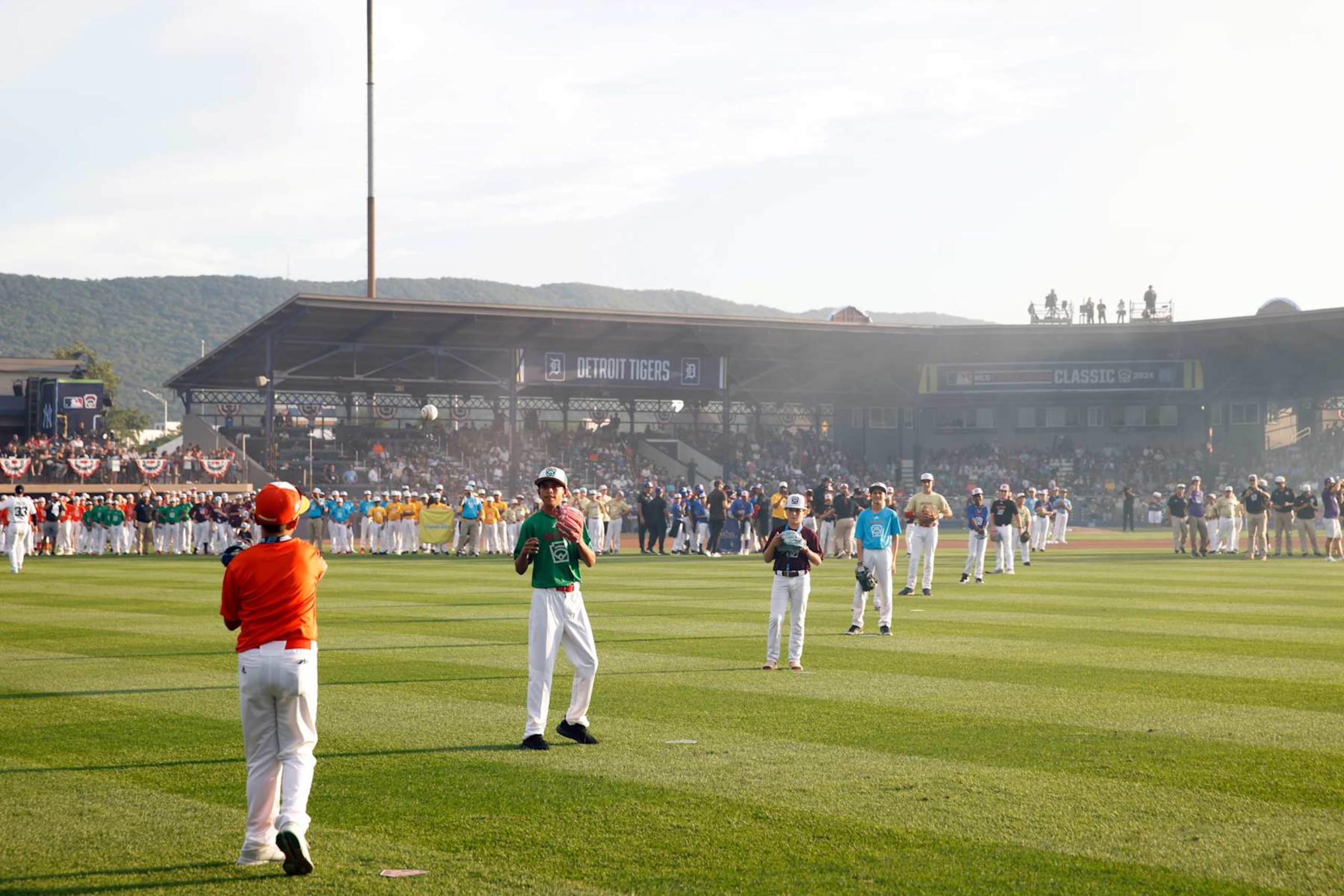 WILLIAMSPORT , PA - AUGUST 18:  Participants in the 2024 Little League International World Series throw out tthe ceremonial first pitch prior to the 2024 Little League Classic game between the New York Yankees and the Detroit Tigers at Journey Bank Ballpark at Historic Bowman Field on Sunday, August 18, 2024 in Williamsport , Pennsylvania. (Photo by Rob Tringali/MLB Photos via Getty Images)