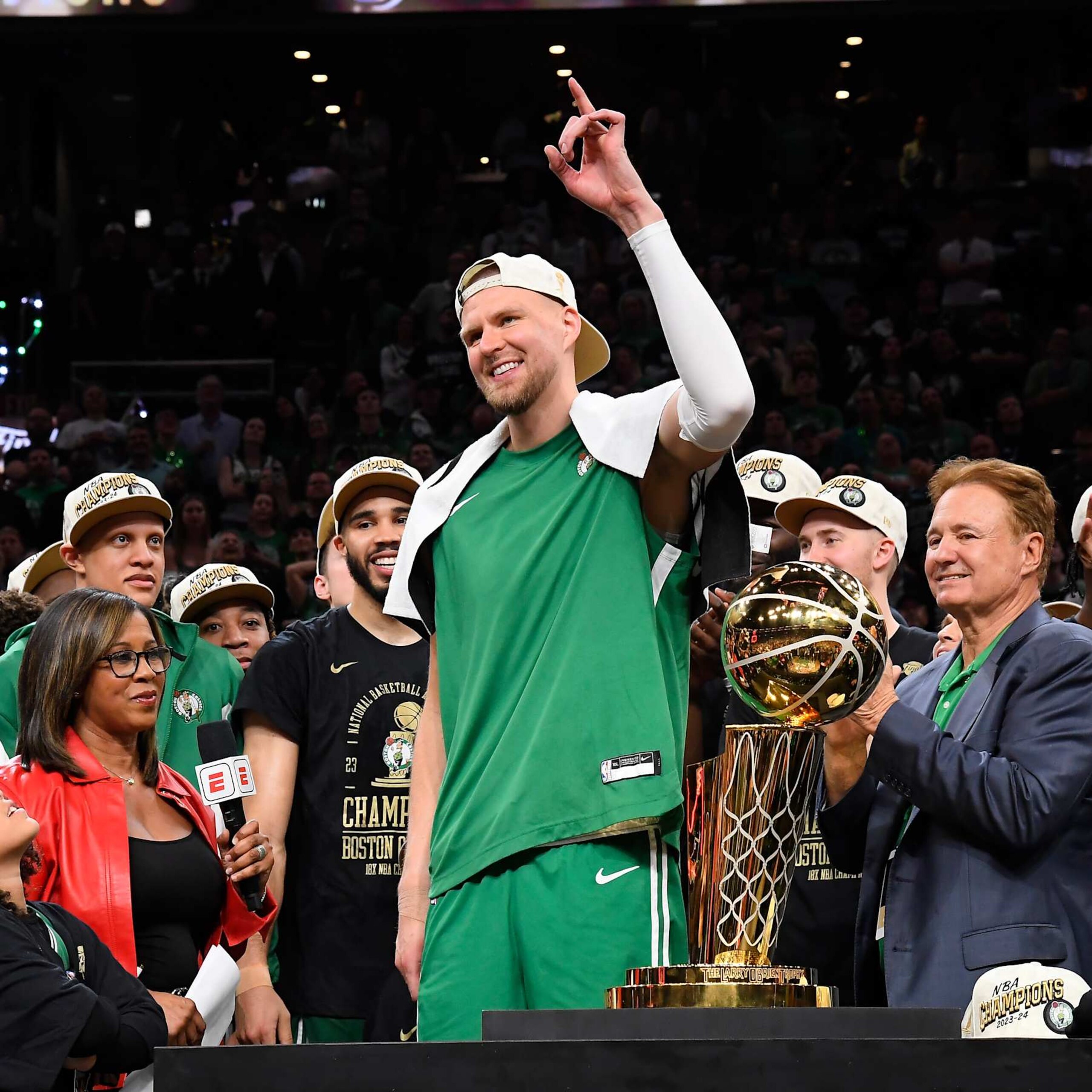 BOSTON, MA - JUNE 17: Kristaps Porzingis #8 of the Boston Celtics of the Boston Celtics celebrates with the Larry O'Brien Trophy after the game against the Dallas Mavericks during Game 5 of the 2024 NBA Finals on June 17, 2024 at the TD Garden in Boston, Massachusetts. NOTE TO USER: User expressly acknowledges and agrees that, by downloading and or using this photograph, User is consenting to the terms and conditions of the Getty Images License Agreement. Mandatory Copyright Notice: Copyright 2024 NBAE  (Photo by Brian Babineau/NBAE via Getty Images)