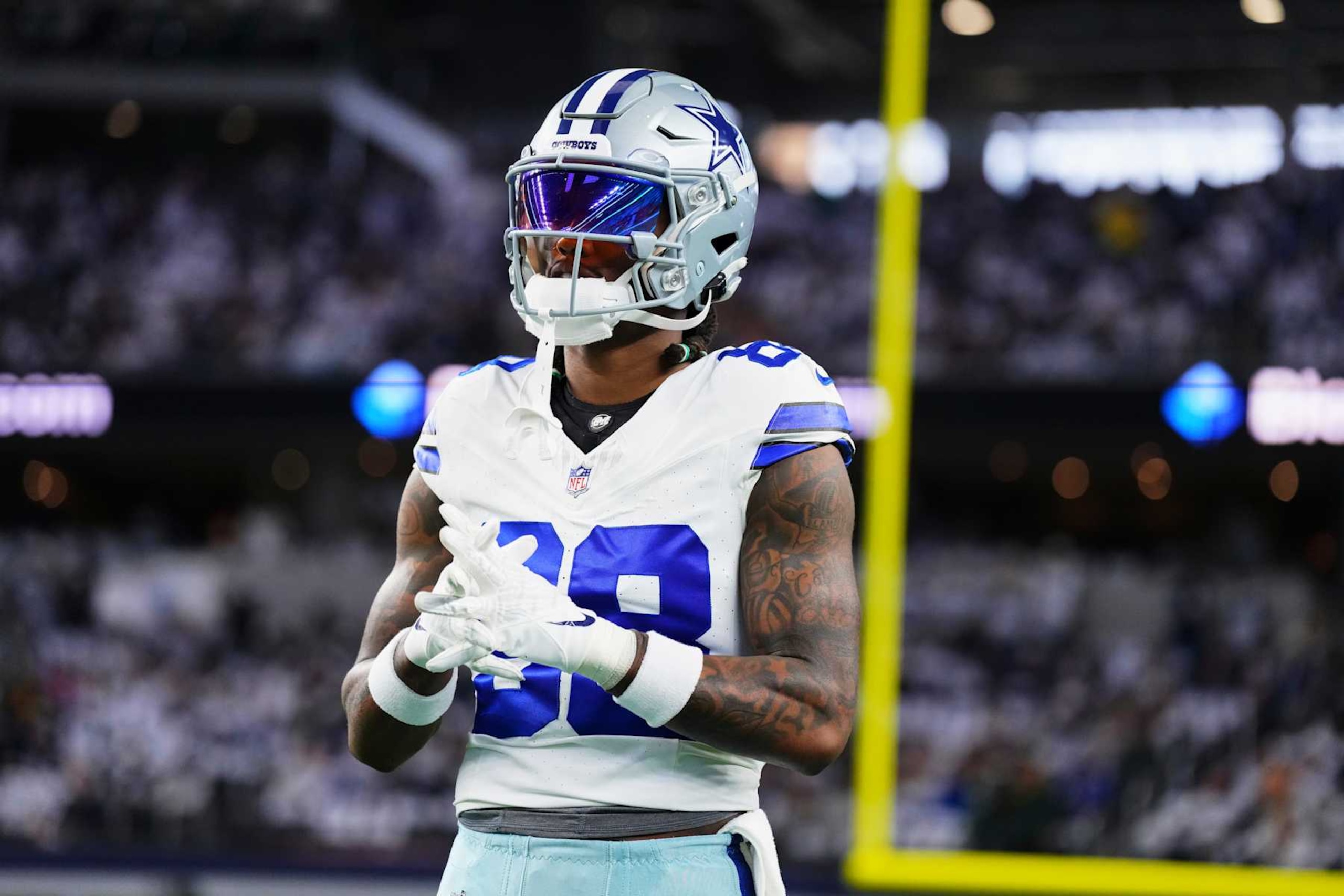 DALLAS, TX - JANUARY 14: CeeDee Lamb #88 of the Dallas Cowboys warms up before kickoff against the Green Bay Packers during the NFC Wild Card playoff game at AT&T Stadium on January 14, 2024 in Dallas, Texas. (Photo by Cooper Neill/Getty Images)