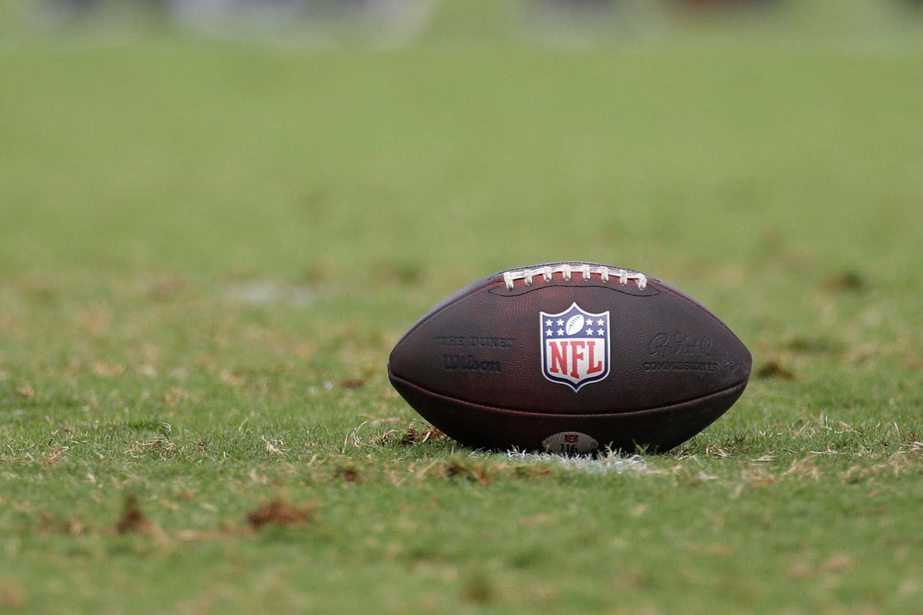 CINCINNATI, OH - JULY 29: A football with the NFL logo sits on the field during the Cincinnati Bengals training camp at Kettering Health Practice Fields on July 29, 2024 in Cincinnati, Ohio. (Photo by Ian Johnson/Icon Sportswire via Getty Images)