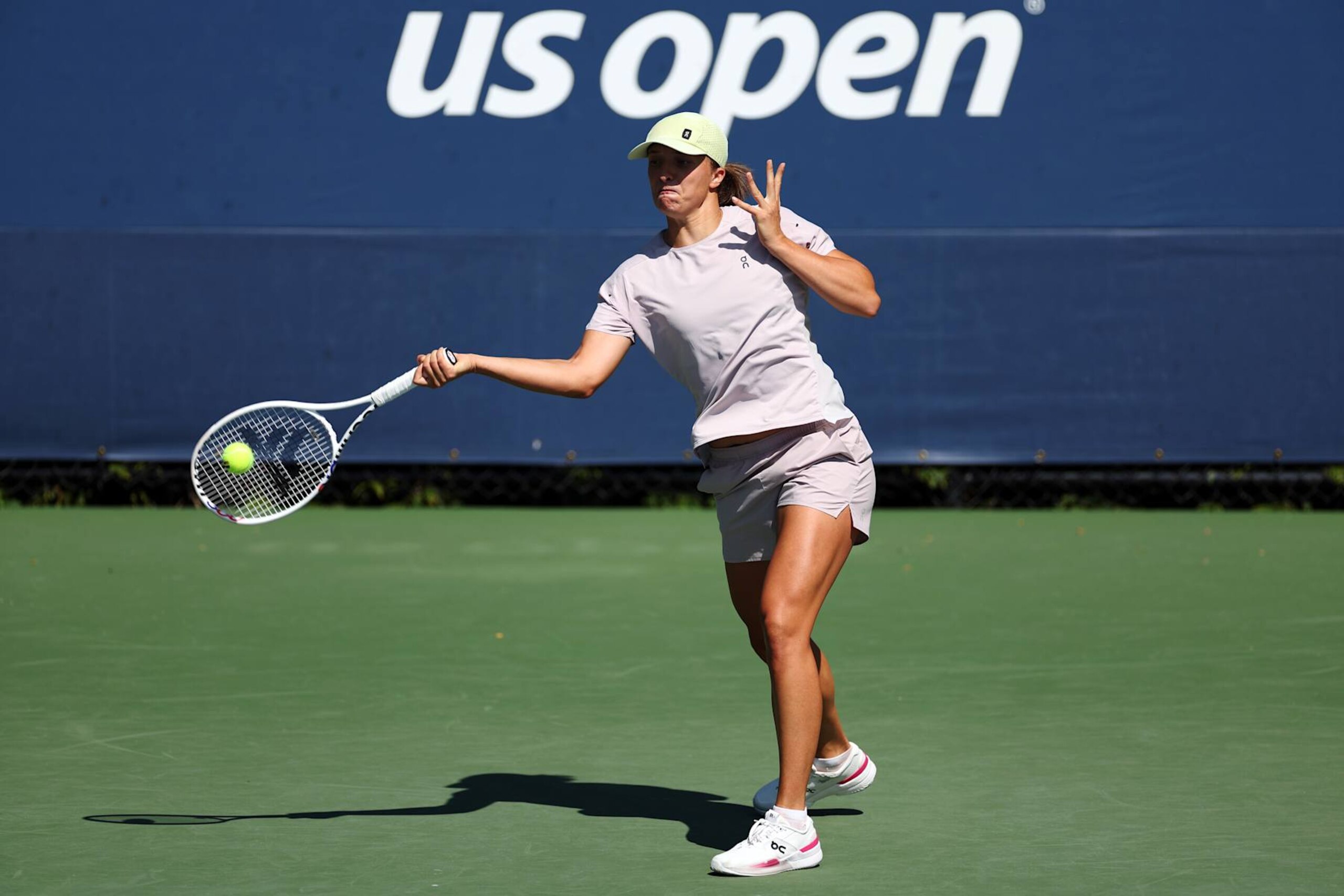 NEW YORK, NEW YORK - AUGUST 22: Iga Swiatek of Poland returns the ball during a practice session prior to the start of the 2024 US Open at USTA Billie Jean King National Tennis Center on August 22, 2024 in the Flushing neighborhood of the Queens borough of New York City. (Photo by Sarah Stier/Getty Images)