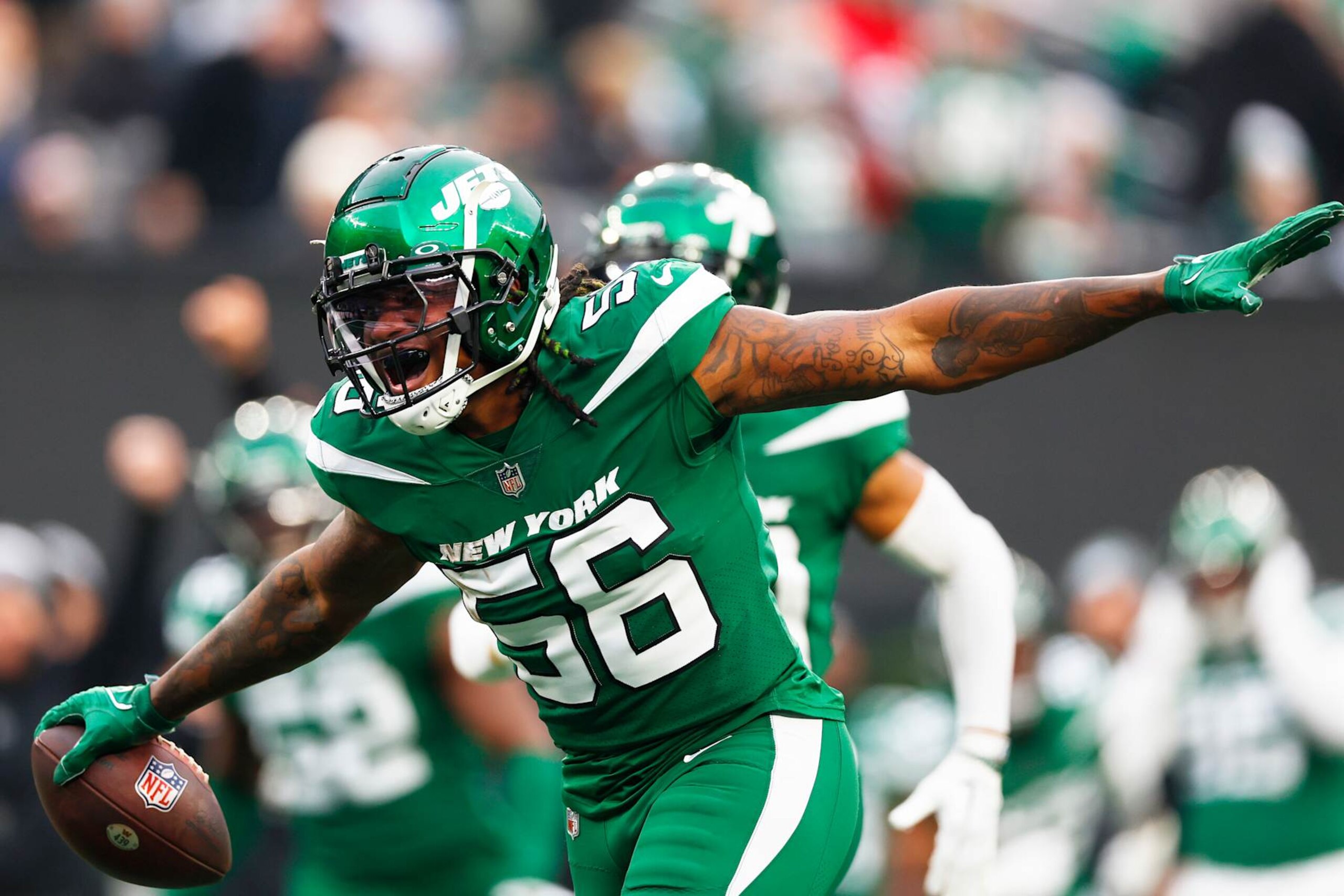 EAST RUTHERFORD, NEW JERSEY - DECEMBER 24: Quincy Williams #56 of the New York Jets celebrates an interception during the third quarter against the Washington Commanders at MetLife Stadium on December 24, 2023 in East Rutherford, New Jersey. (Photo by Rich Schultz/Getty Images) EAST RUTHERFORD, NEW JERSEY - DECEMBER 24: Quincy Williams #56 of the New York Jets celebrates an interception during the third quarter against the Washington Commanders at MetLife Stadium on December 24, 2023 in East Rutherford, New Jersey. (Photo by Rich Schultz/Getty Images)