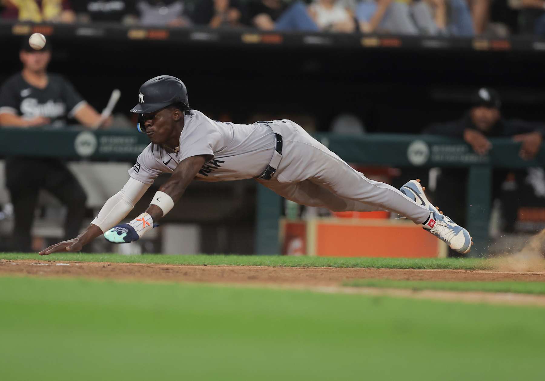 CHICAGO, IL - AUGUST 12: Jazz Chisholm Jr. #13 of the New York Yankees slides into home plate during a baseball game against the Chicago White Sox on August 12, 2024 at Guaranteed Rate Field in Chicago,Illinois. (Photo by Melissa Tamez/Icon Sportswire via Getty Images)