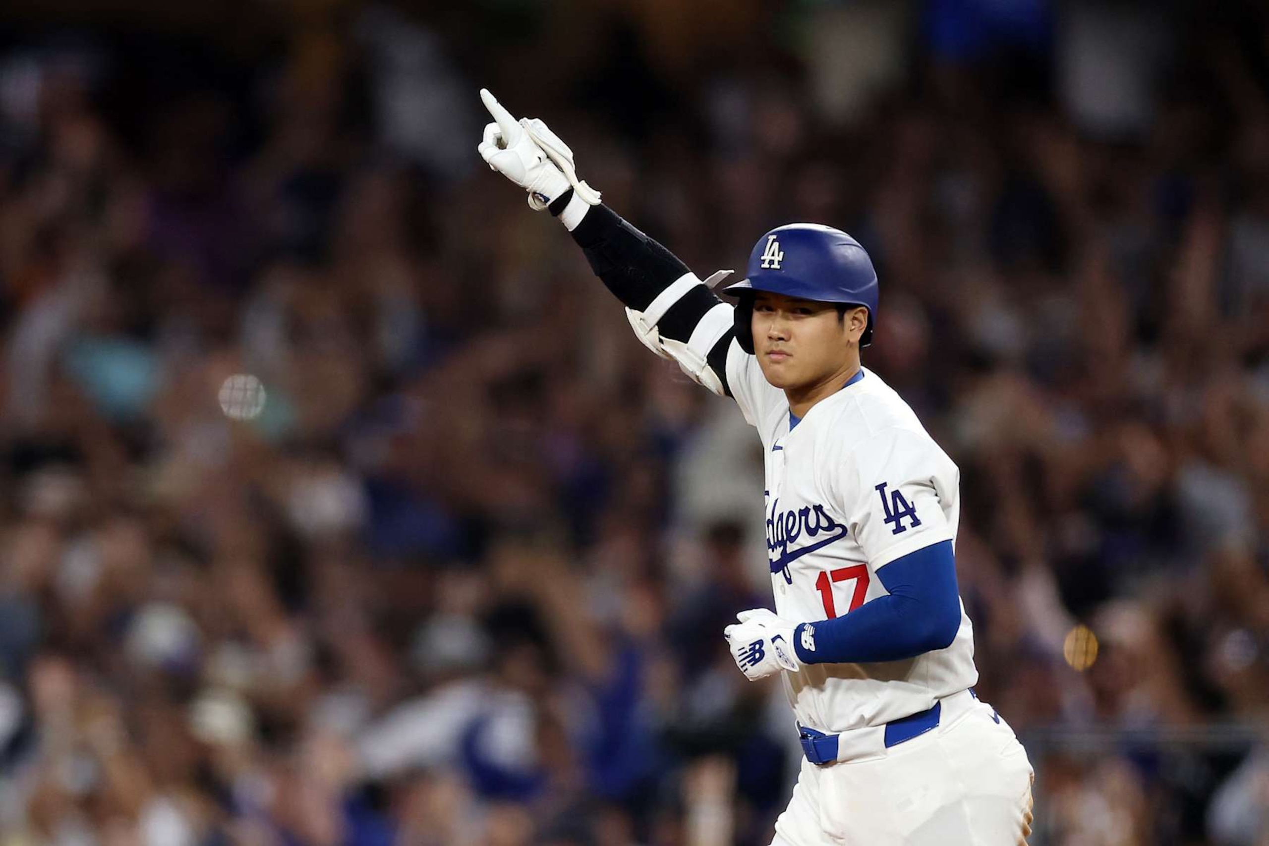 LOS ANGELES, CALIFORNIA - AUGUST 23: Shohei Ohtani #17 of the Los Angeles Dodgers celebrates after hitting a walk-off grand slam home run, his 40th home run of the season, against the Tampa Bay Rays at Dodger Stadium on August 23, 2024 in Los Angeles, California. (Photo by Katelyn Mulcahy/Getty Images)