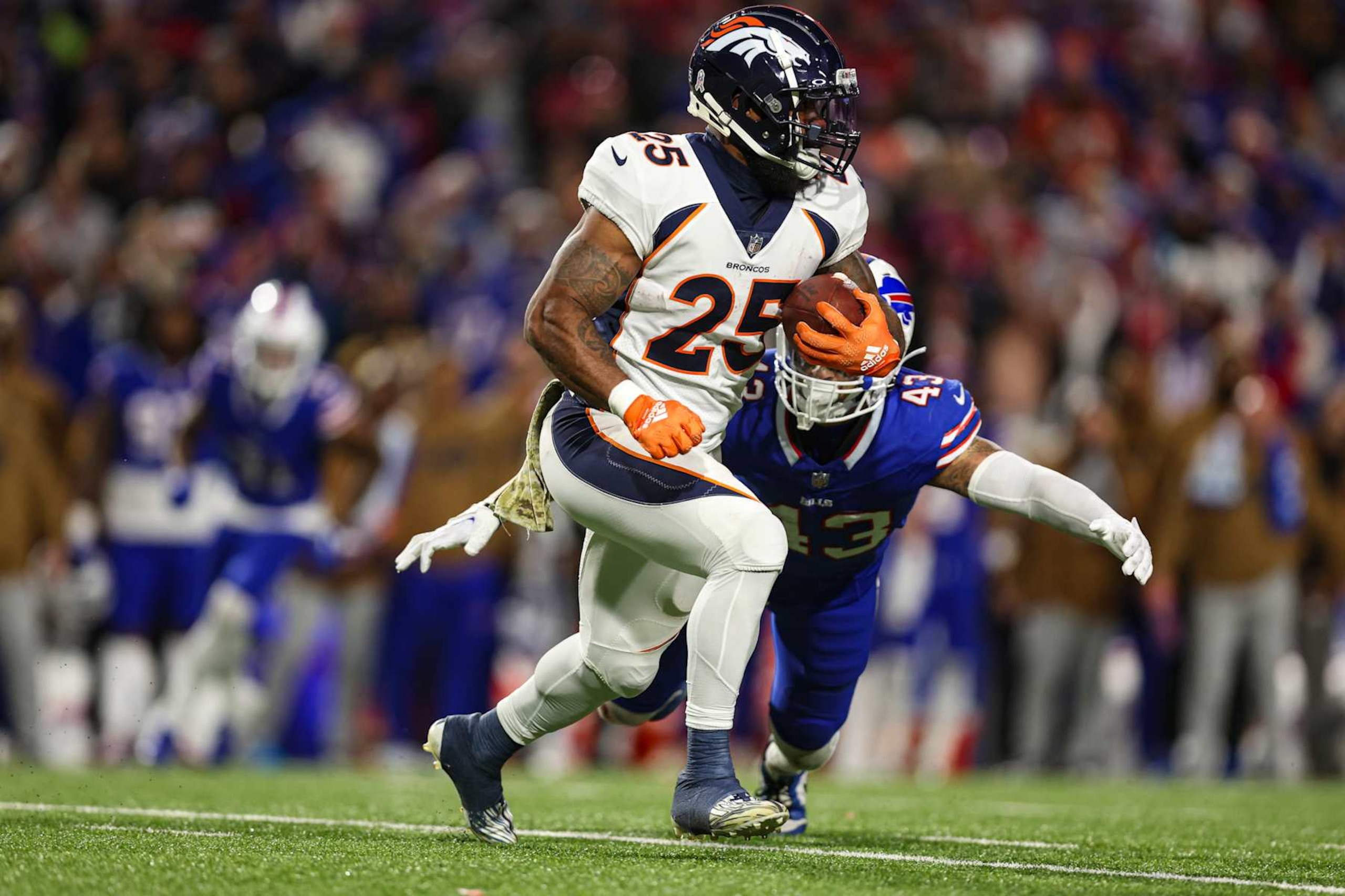 ORCHARD PARK, NY - NOVEMBER 13: Samaje Perine #25 of the Denver Broncos runs the ball during an NFL football game against the Buffalo Bills at Highmark Stadium on November 13, 2023 in Orchard Park, New York. (Photo by Perry Knotts/Getty Images)